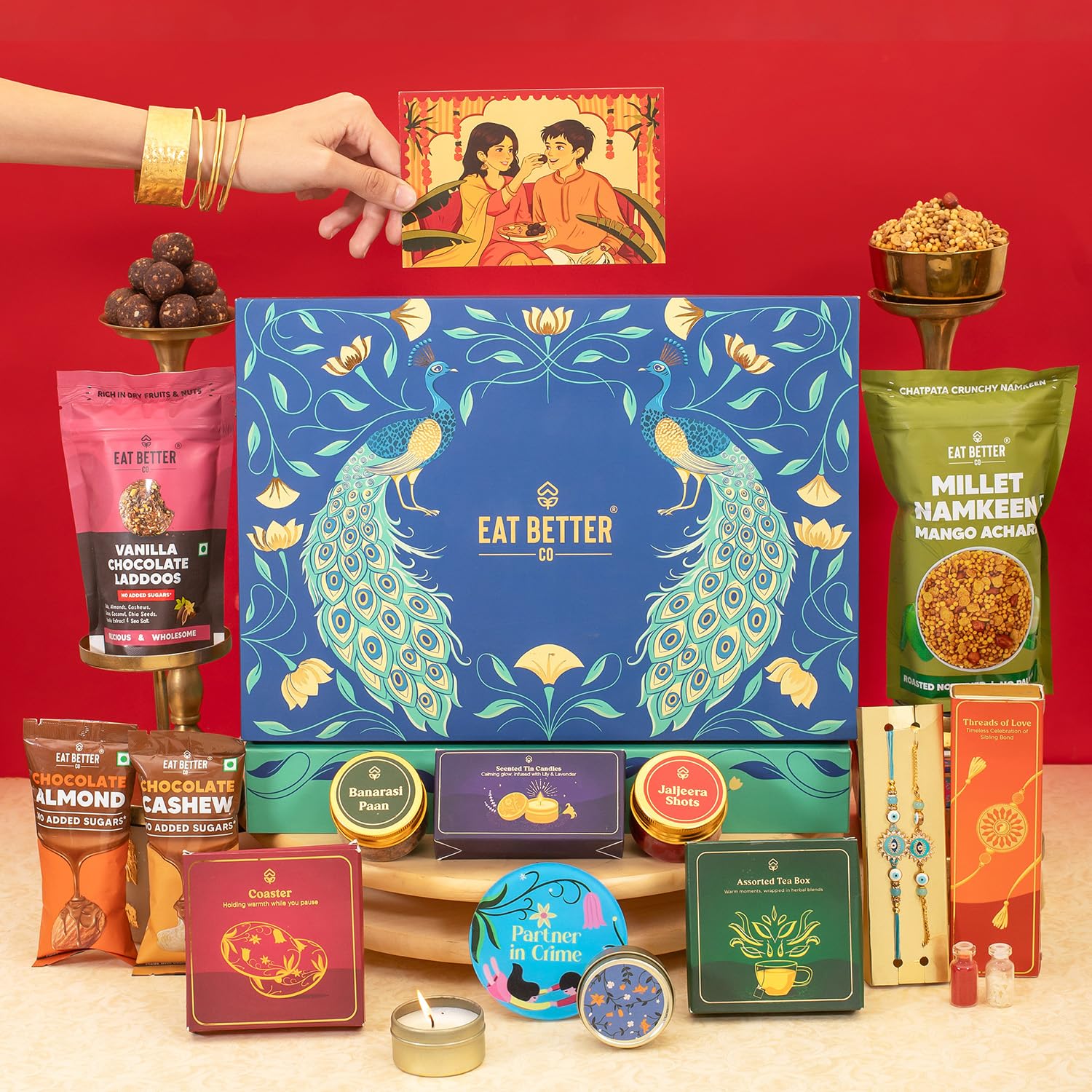 Eat Better Co - Mayur - Rakhi Gift Hamper 14 Item-Evil Eye & Bracelet, Vanilla Chocolate Dry - Fruit Laddoos, Chocolate Coated Almonds & Cashews - Bhai Bhabhi Rakhi Set with Gift-image-10