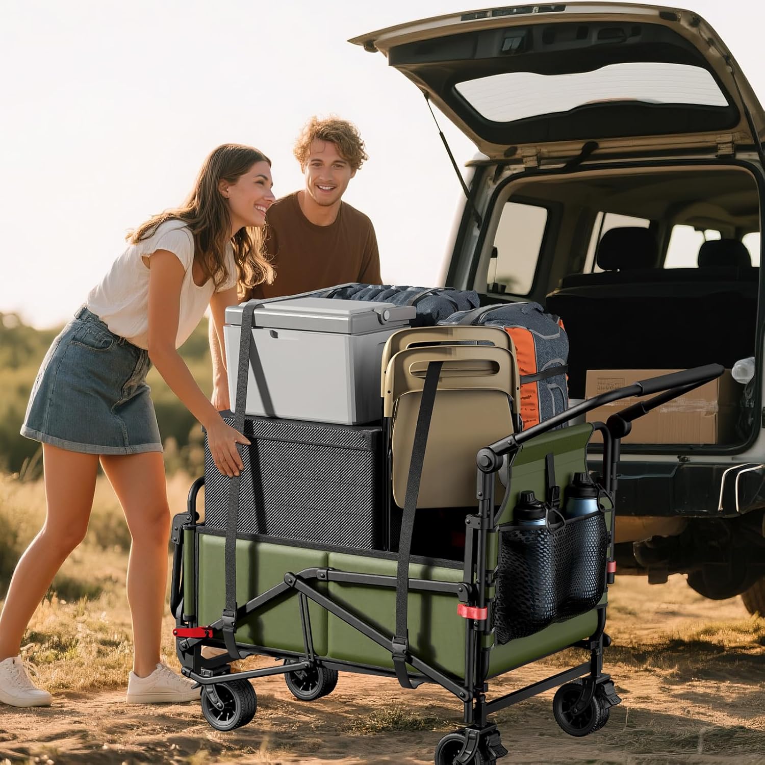 People loading the heavy-duty folding wagon with camping gear into a car
