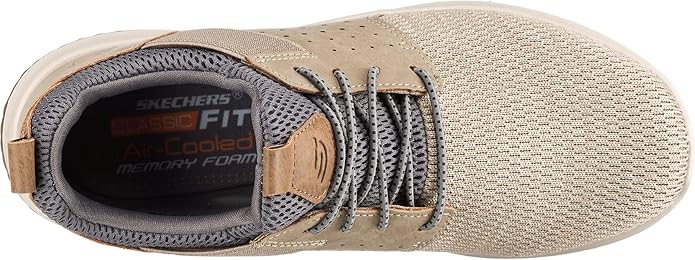 The Relaxed Fit design provides a roomy and comfortable fit that allows for all-day wear without any discomfort. The shoes also have a memory foam cushioned insole that provides a soft and supportive feel for long-lasting comfort. The flexible rubber traction outsole offers stability and grip on various surfaces, making these shoes suitable for a range of activities.