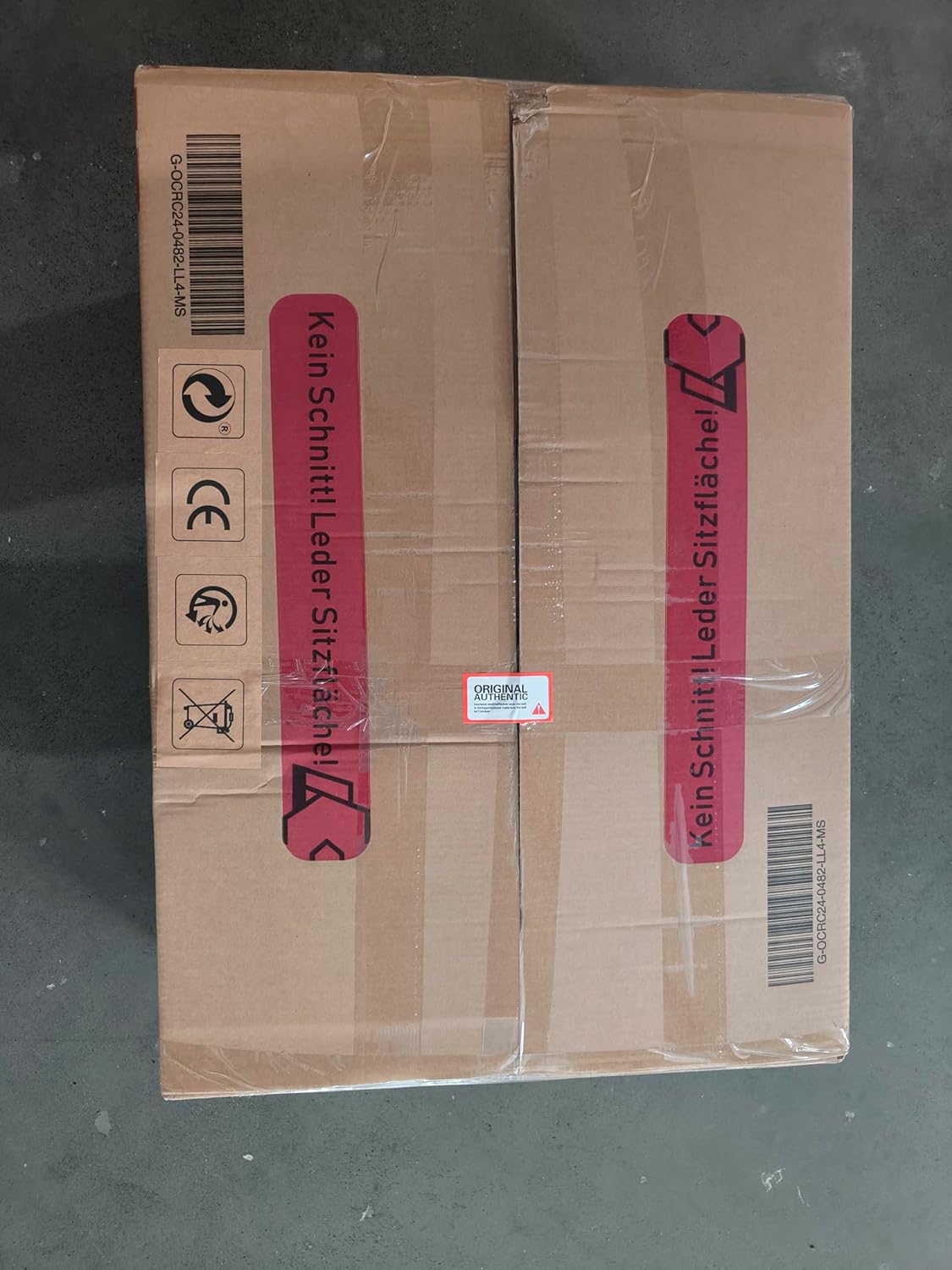 Shipping box with warning 'Kein Schnitt! Leder Sitzfläche!' (Do not cut! Leather seat surface!)