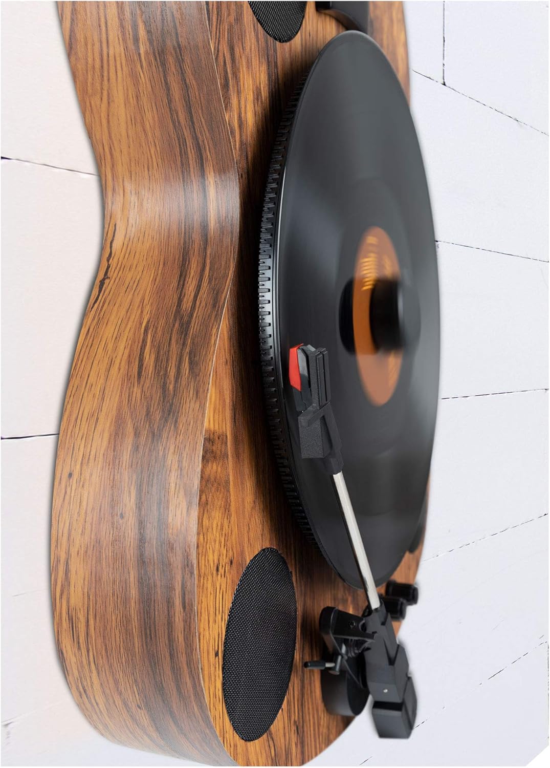 Close-up of the Beatfoxx GT-25 Chuck turntable playing a vinyl record in a vertical position.