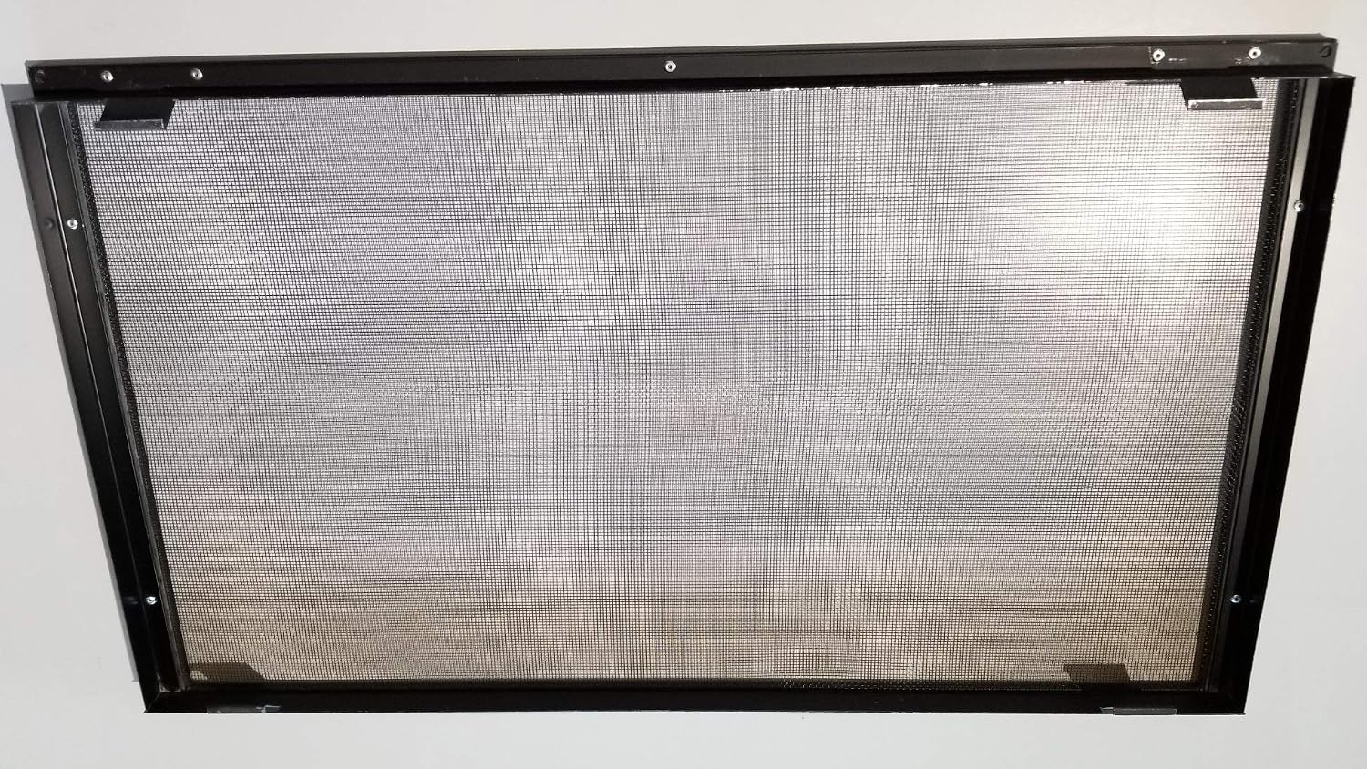 Angled view of the Kingsman/Marquis Fireplace Screen Barrier, showing mounting tabs