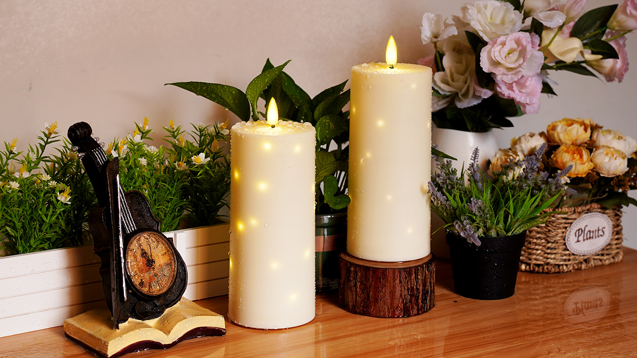 Image of kakoya 10 inch x 4 inch Large Outdoor Waterproof Flickering Flameless Candles with Timer,2Pcs Battery Operated LED Pillar Candles with Embedded Star String for Outdoor Lanterns,Porch,Patio Decor(Ivory)
