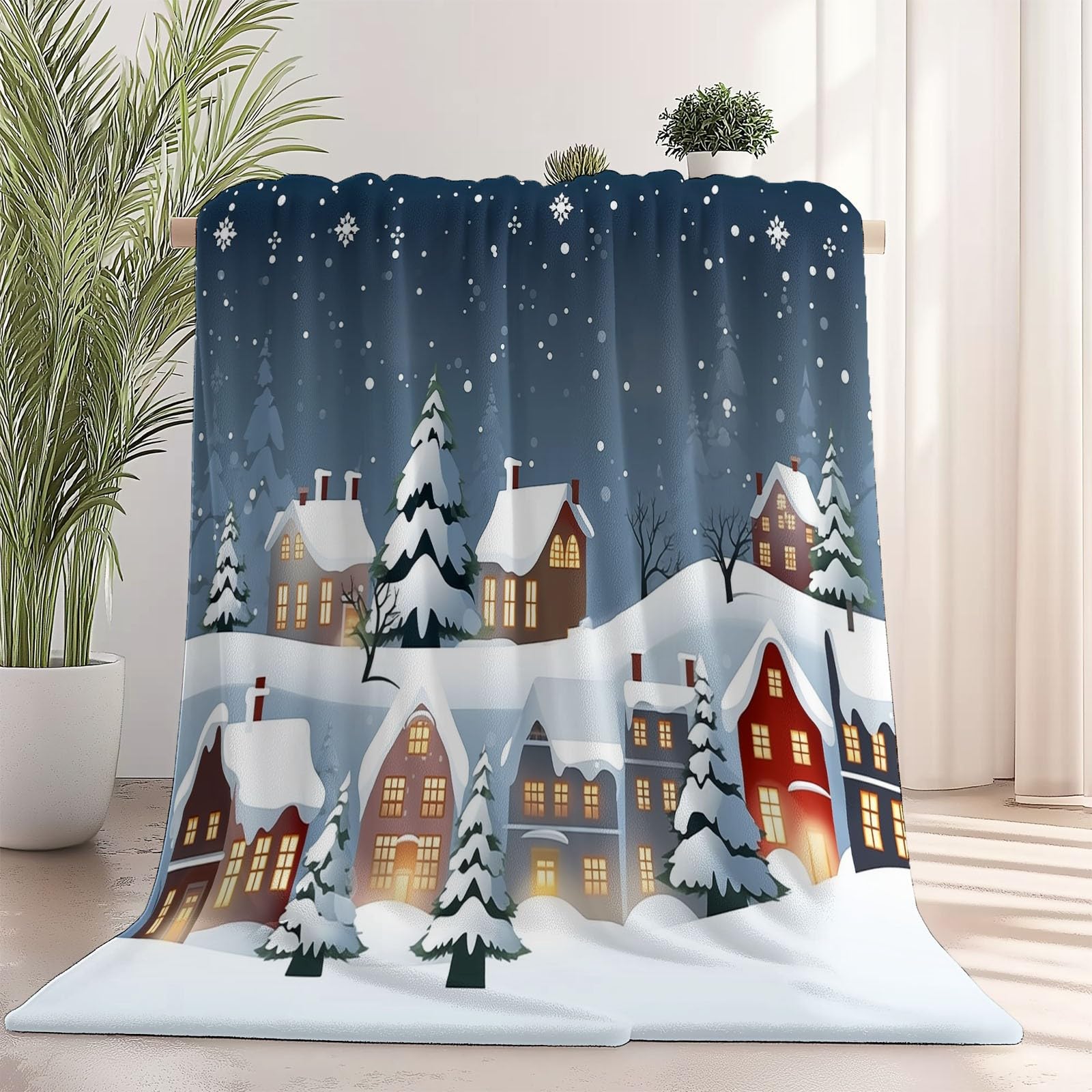 Couvertures et Plaids Village de Neige pour des soirées cocooning au coin du feu