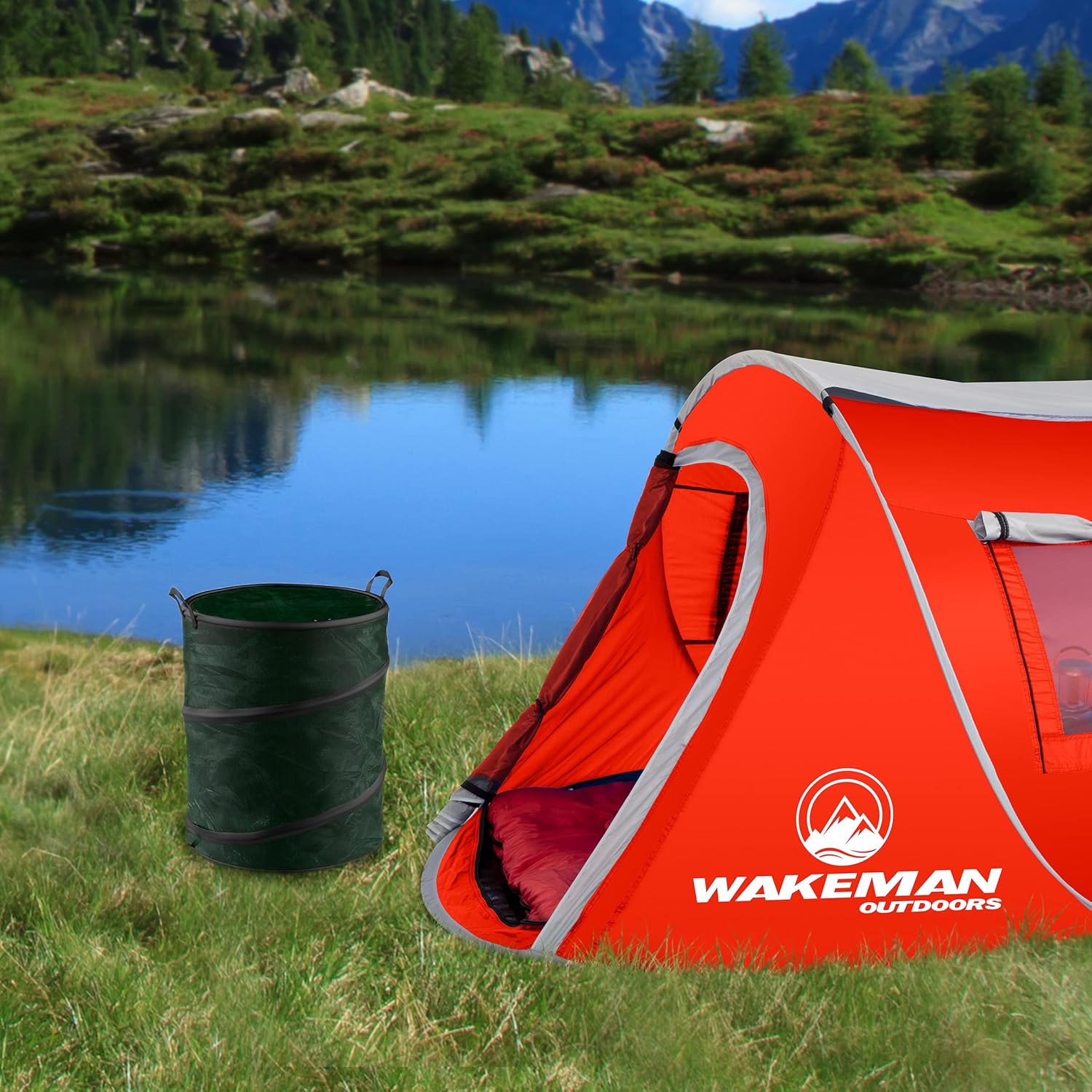 Camping scene with a tent and the green collapsible trash can near a lake.