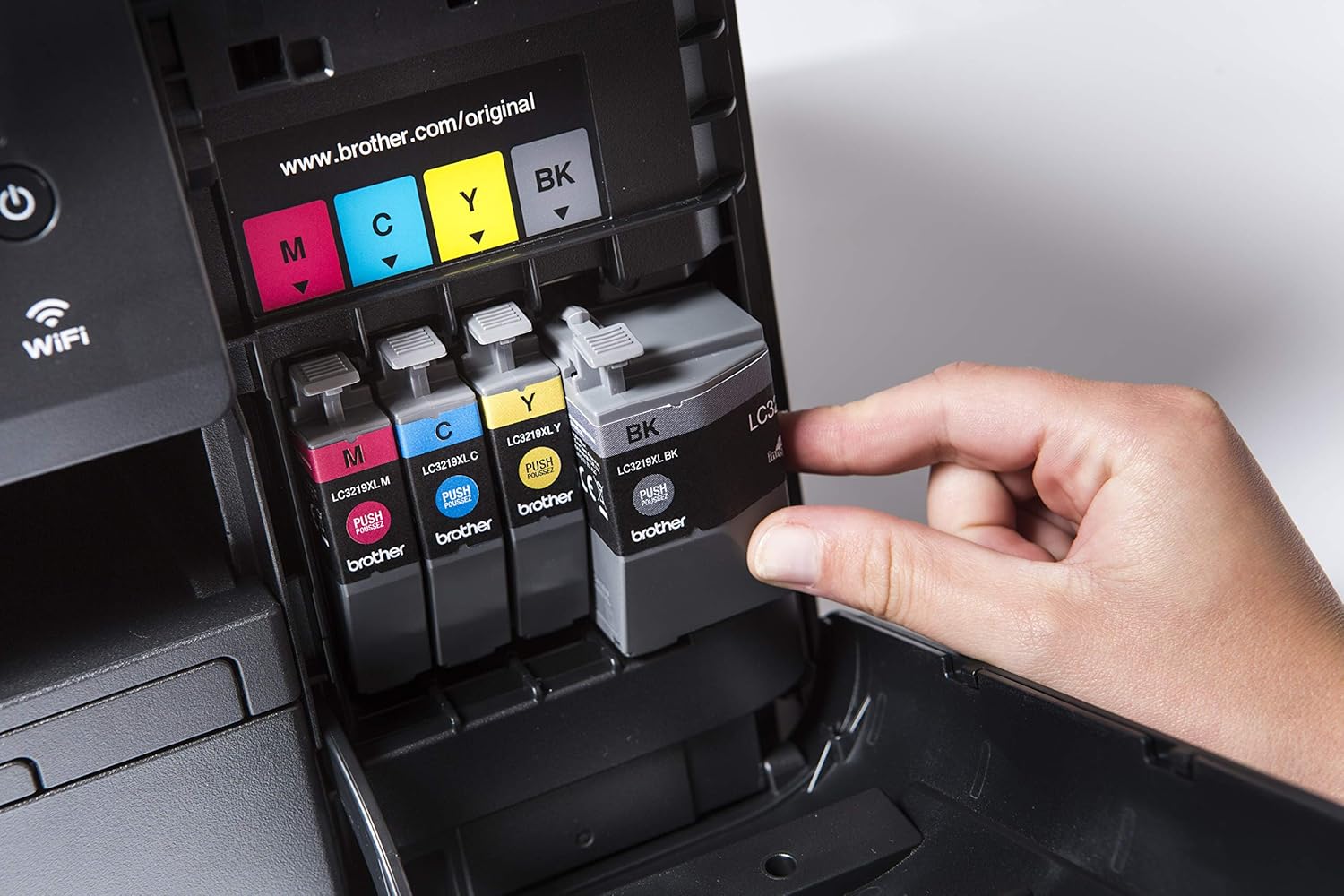 Brother MFC-J5335DW printer with A3 and A4 paper packs, illustrating paper size compatibility.