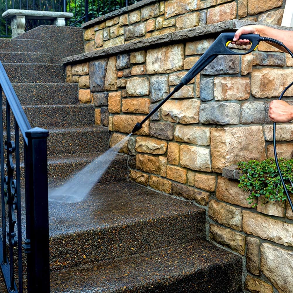 Person using Michelin MPX17EH pressure washer to clean outdoor stairs