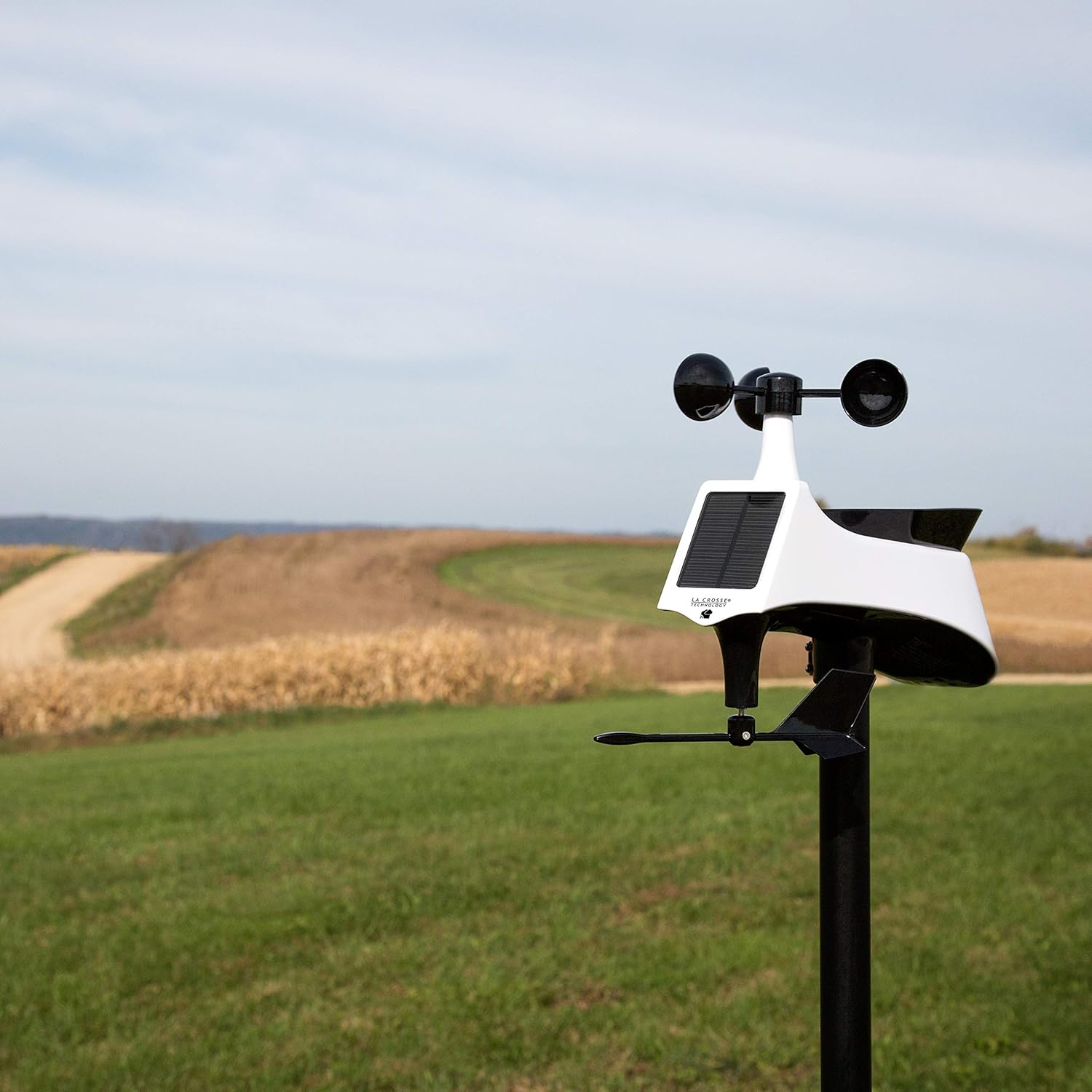 Outdoor multi-sensor installed in an open field for accurate weather data.