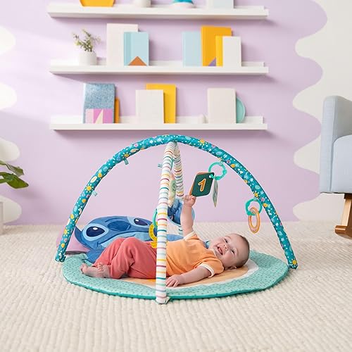 Miniatura 2 de Bright Starts Disney Baby Stitch Party in Paradise Play Gym & Mat, incluye 5 juguetes para llevar con felpa extraíble, a partir de 0 meses