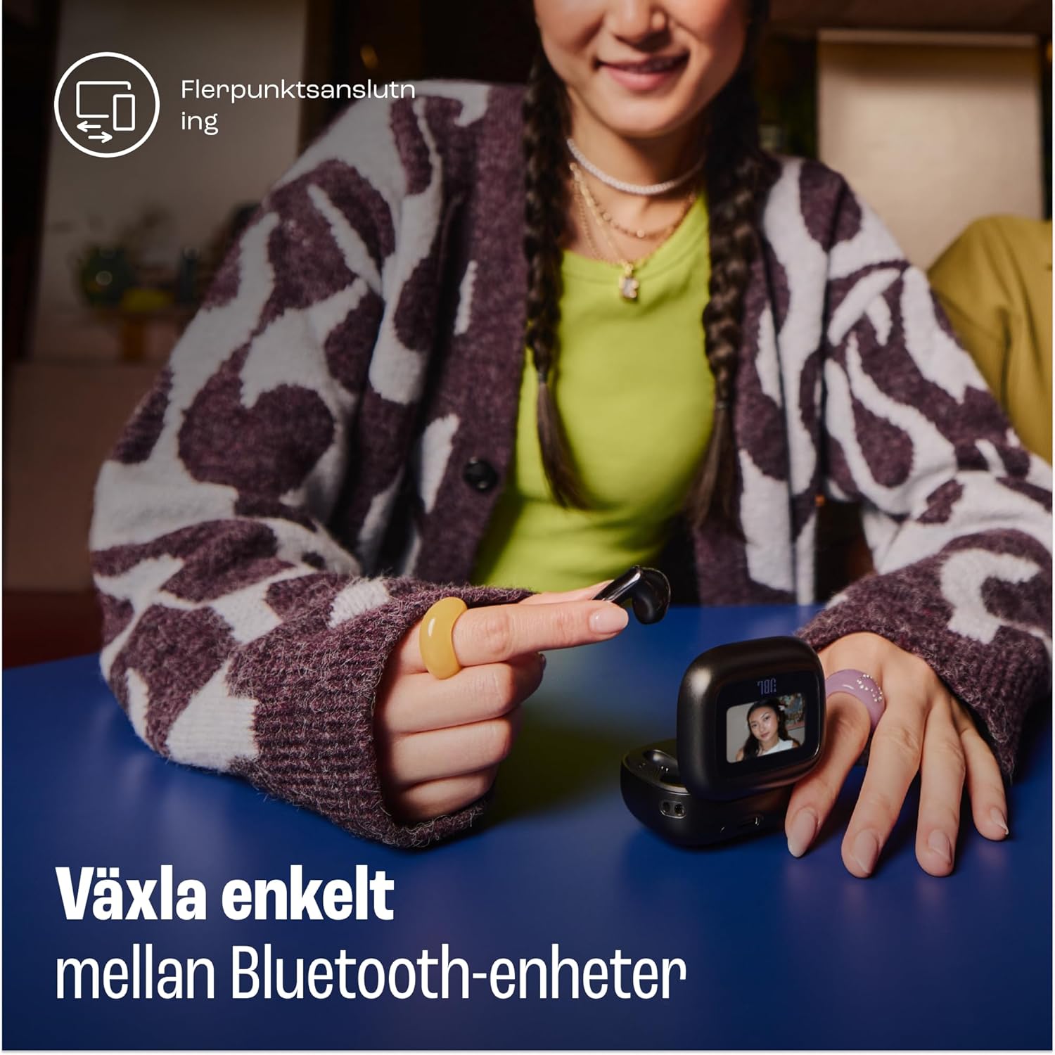 Woman using JBL Live Flex 3 smart charging case to switch between devices