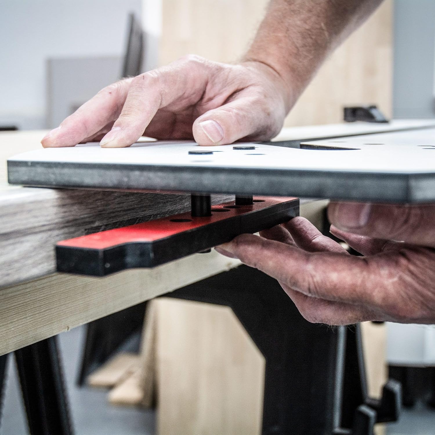Hands placing the jig onto a worktop