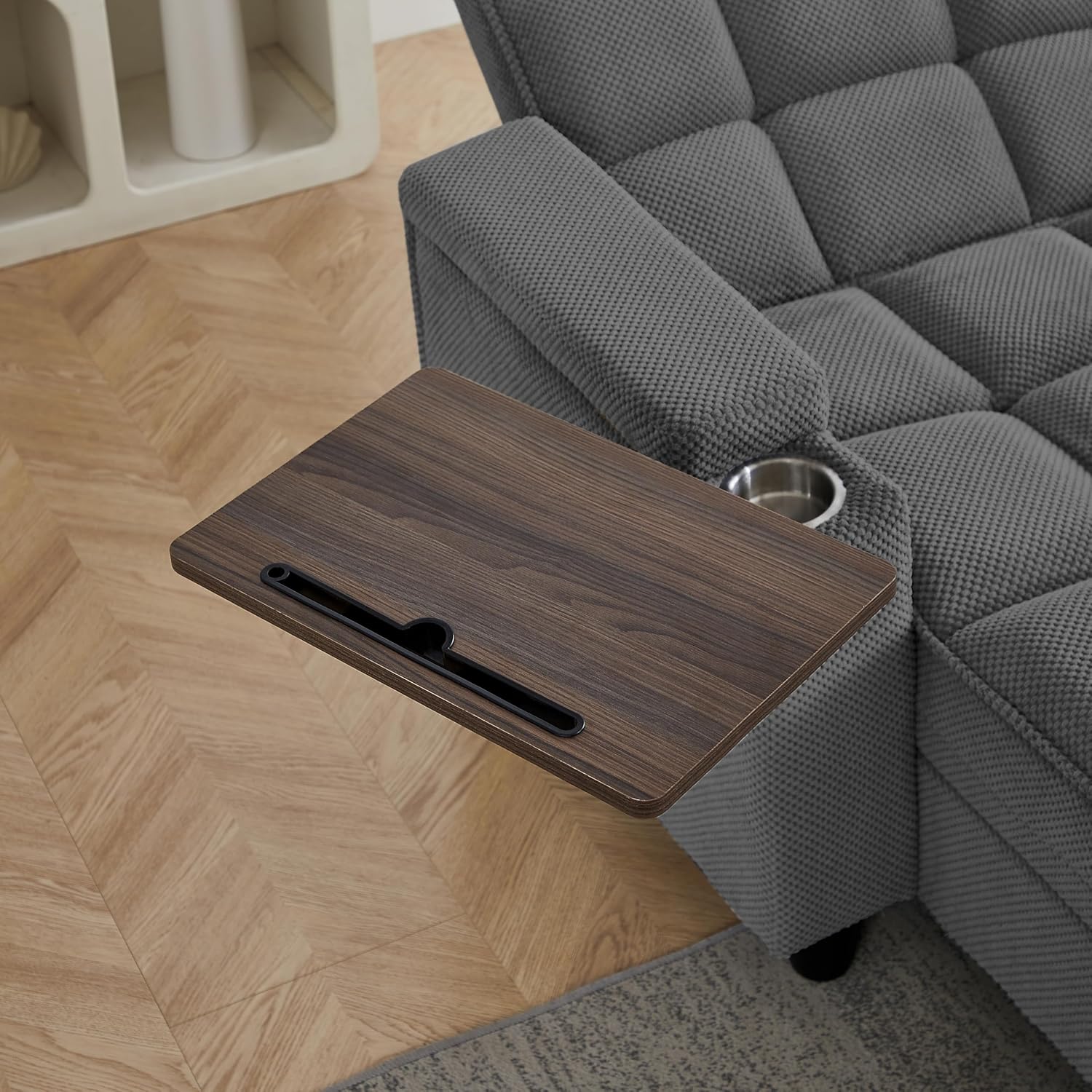 Close-up view of the swivel tray table extended from the armrest of the Eafurn Chaise Lounge.