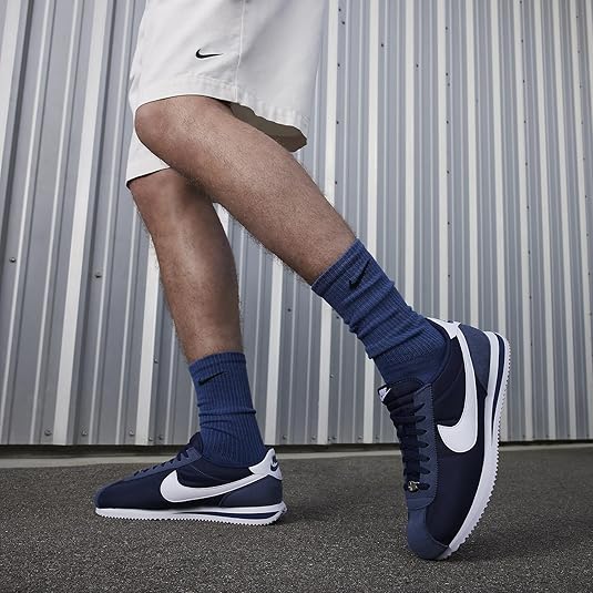 black nike cortez on feet