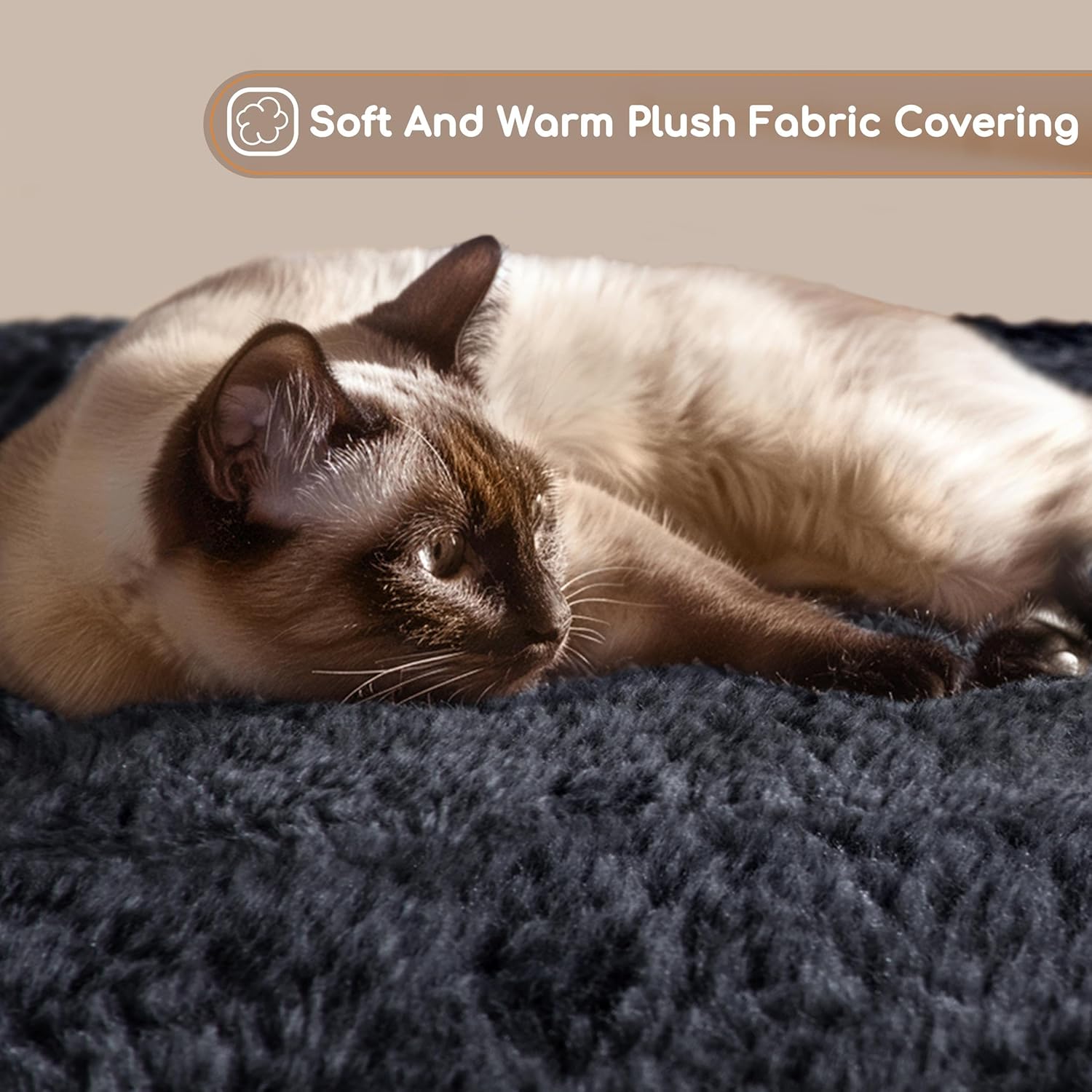 Close-up of a cat resting on the soft plush fabric of the cat tree, highlighting the material.
