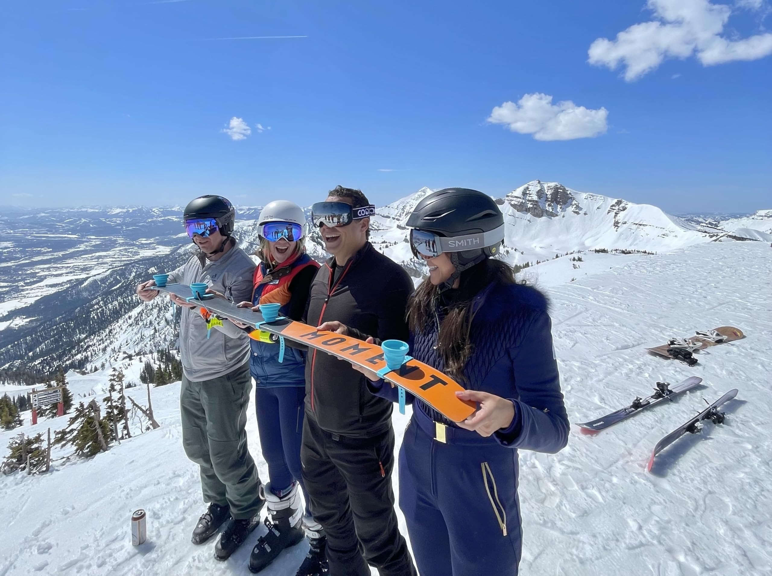 Collapsible and Portable Shot Ski Kit - 4-pack w/ carrying pack. Silicone cups with an adjustable strap that turn any object into a "shot ski"