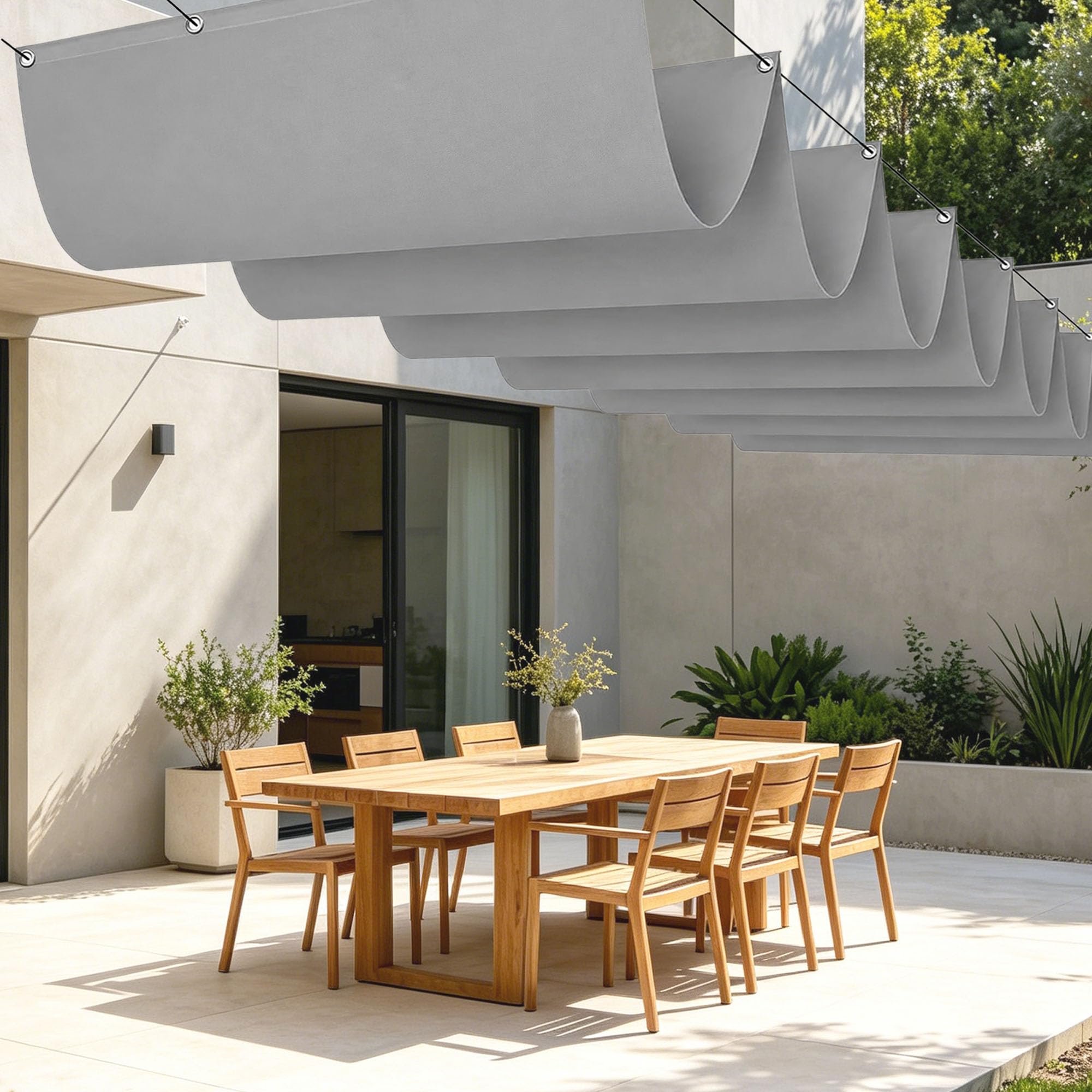 Voile ombrage rétractable vague pour aménager un salon de jardin ombragé en été