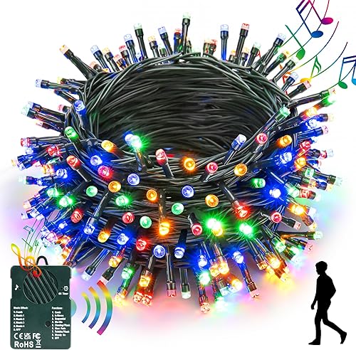 Joomer Luces de Navidad con sensor de movimiento, funciona con pilas, 100 luces LED de 33 pies con 8 modos de iluminación, 4 música alegre para