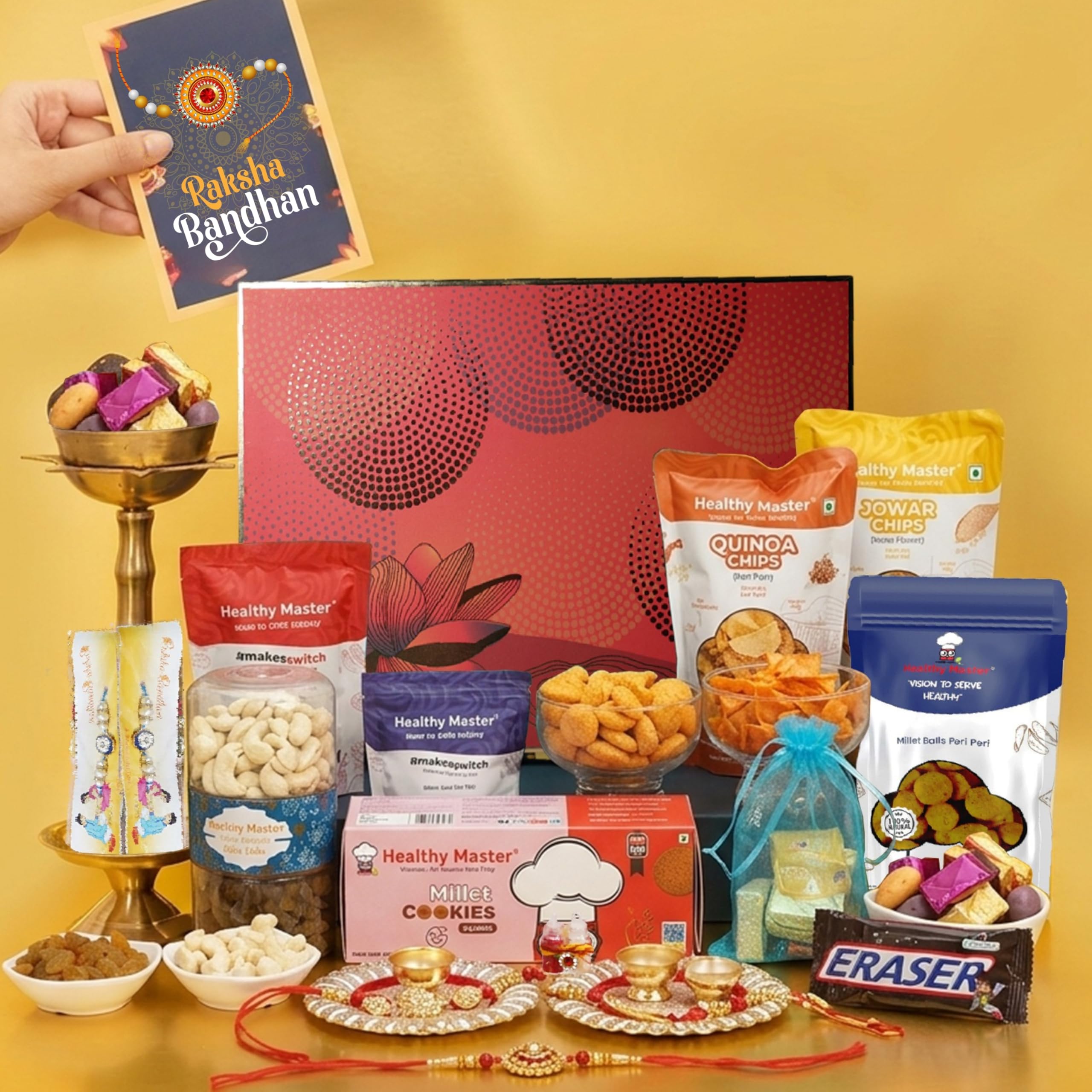 Healthy Master Heritage Rakhi Hamper | Box of 14 Gift for Brother | Healthy Snacks, Chips, Dry Fruits, Bars, Jars, Millet Balls, Khakhra, Badam Crunch Chocolate, Pudina Snacks, Eraser, Rakhi & Kumkum Chawal-image-28