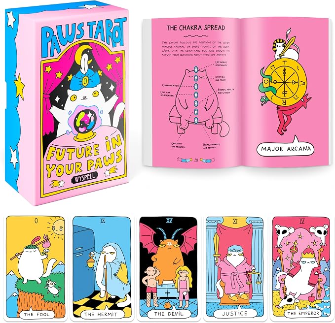 On the top left is a rectangular box with a cat in front of a crystal ball. On the top right is a booklet with a cat and chakras. On the bottom is a set of five different cards with cats.