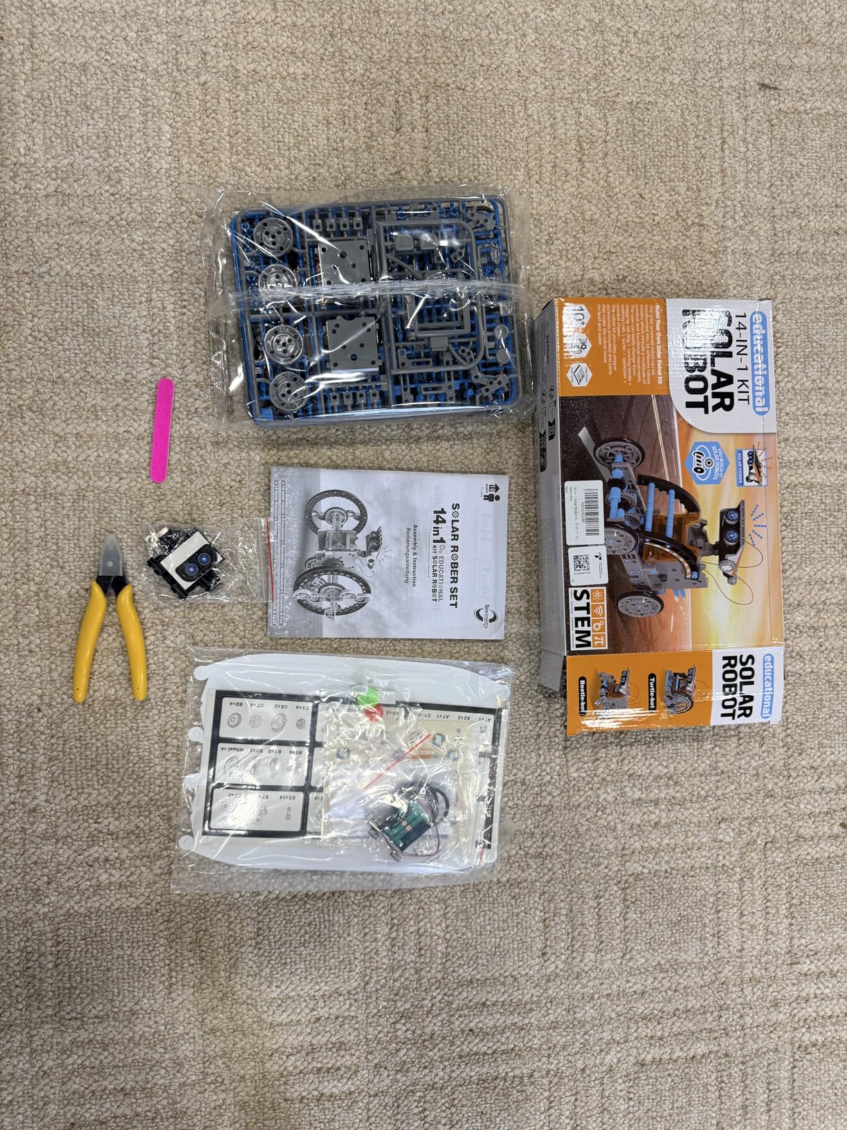 KIDWILL 14-in-1 Solar Robot Kit showing one of the completed robot configurations with the solar panel clearly visible on top