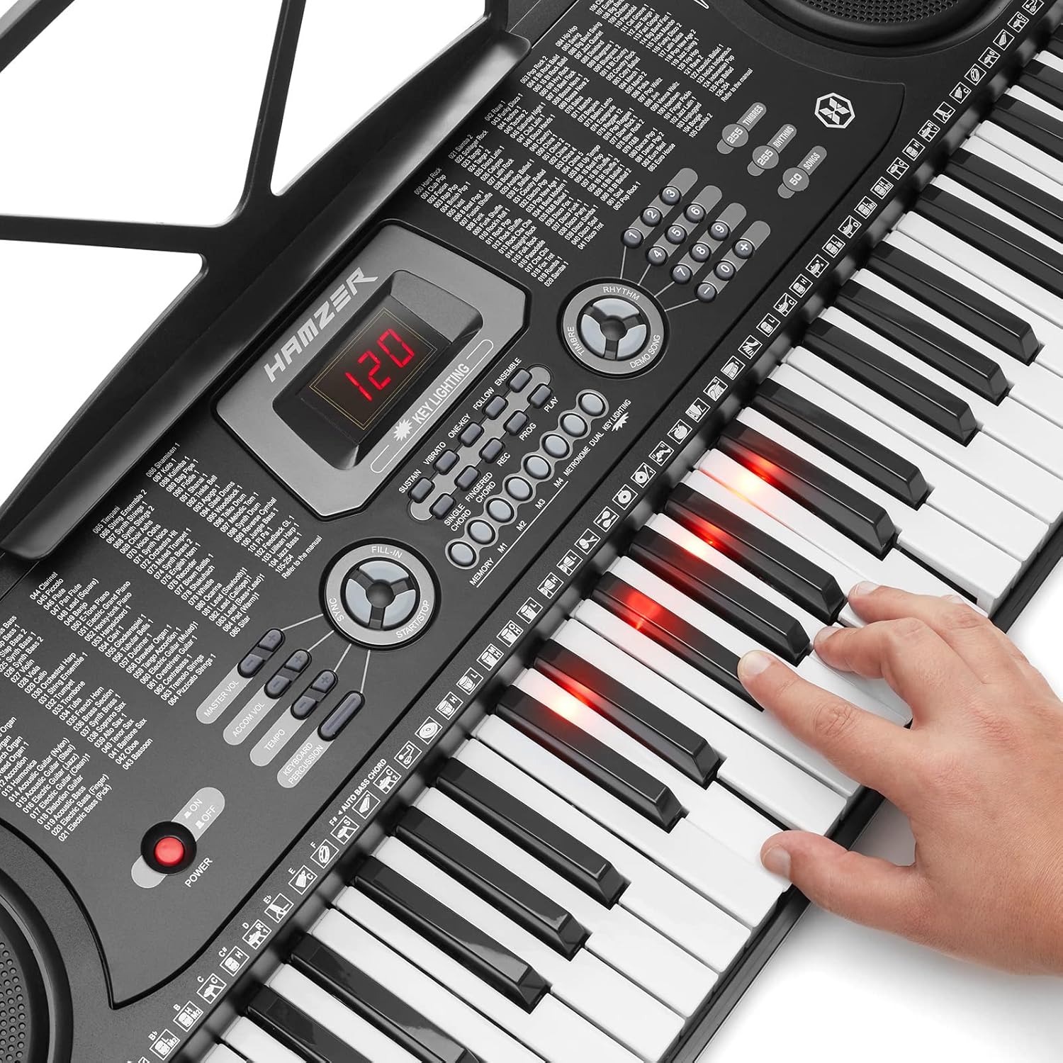 Close-up of the Hamzer keyboard showing lighted keys during a learning mode.