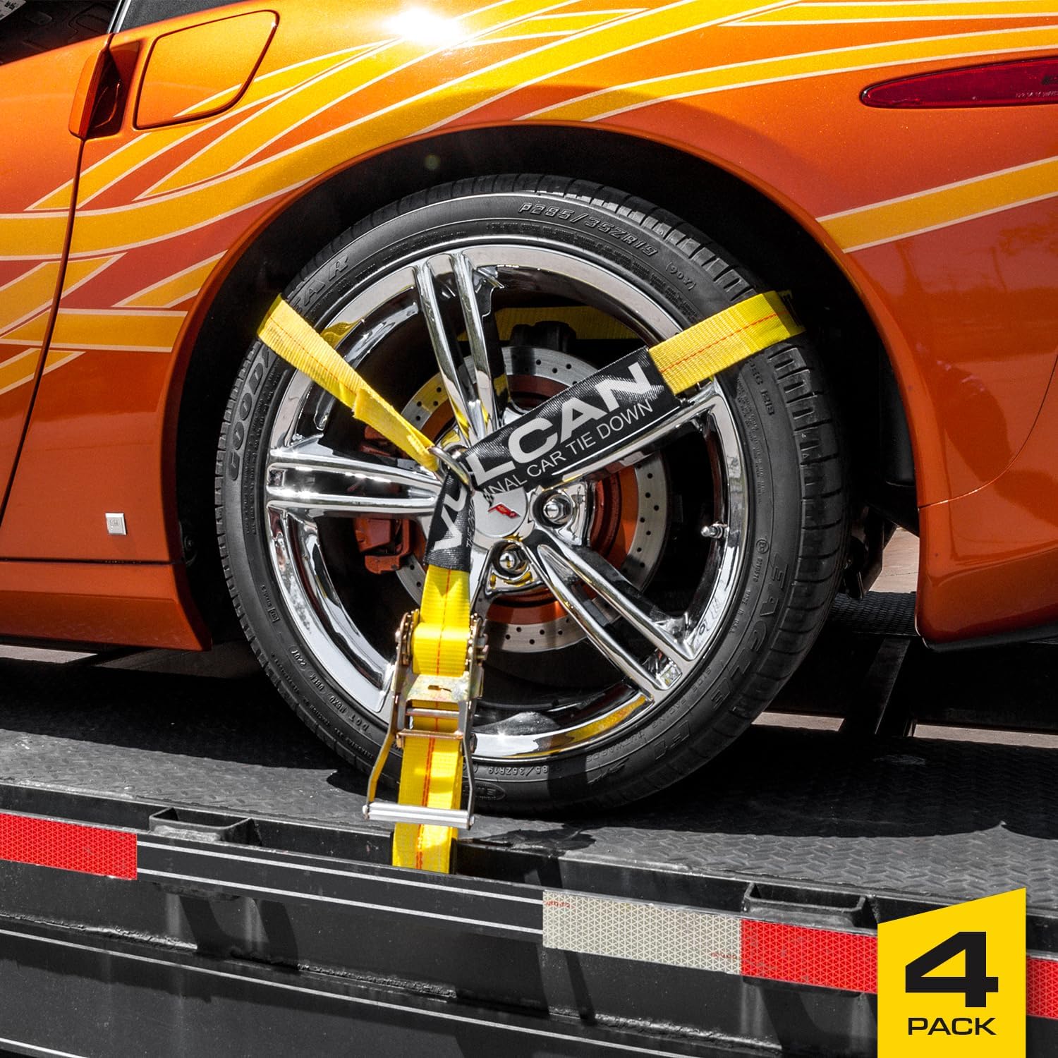 A VULCAN lasso-style tie-down strap secured around a car tire on a trailer.