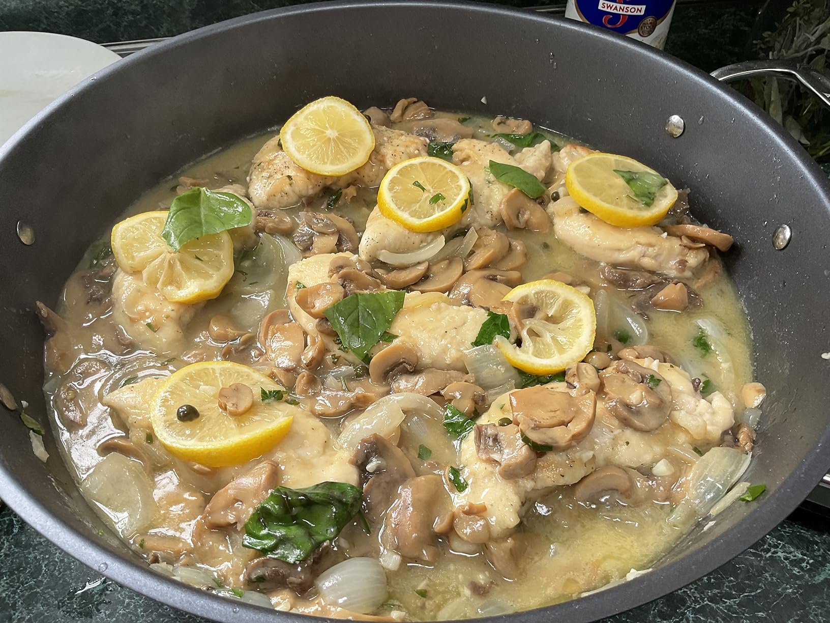 All-Clad skillet in use cooking