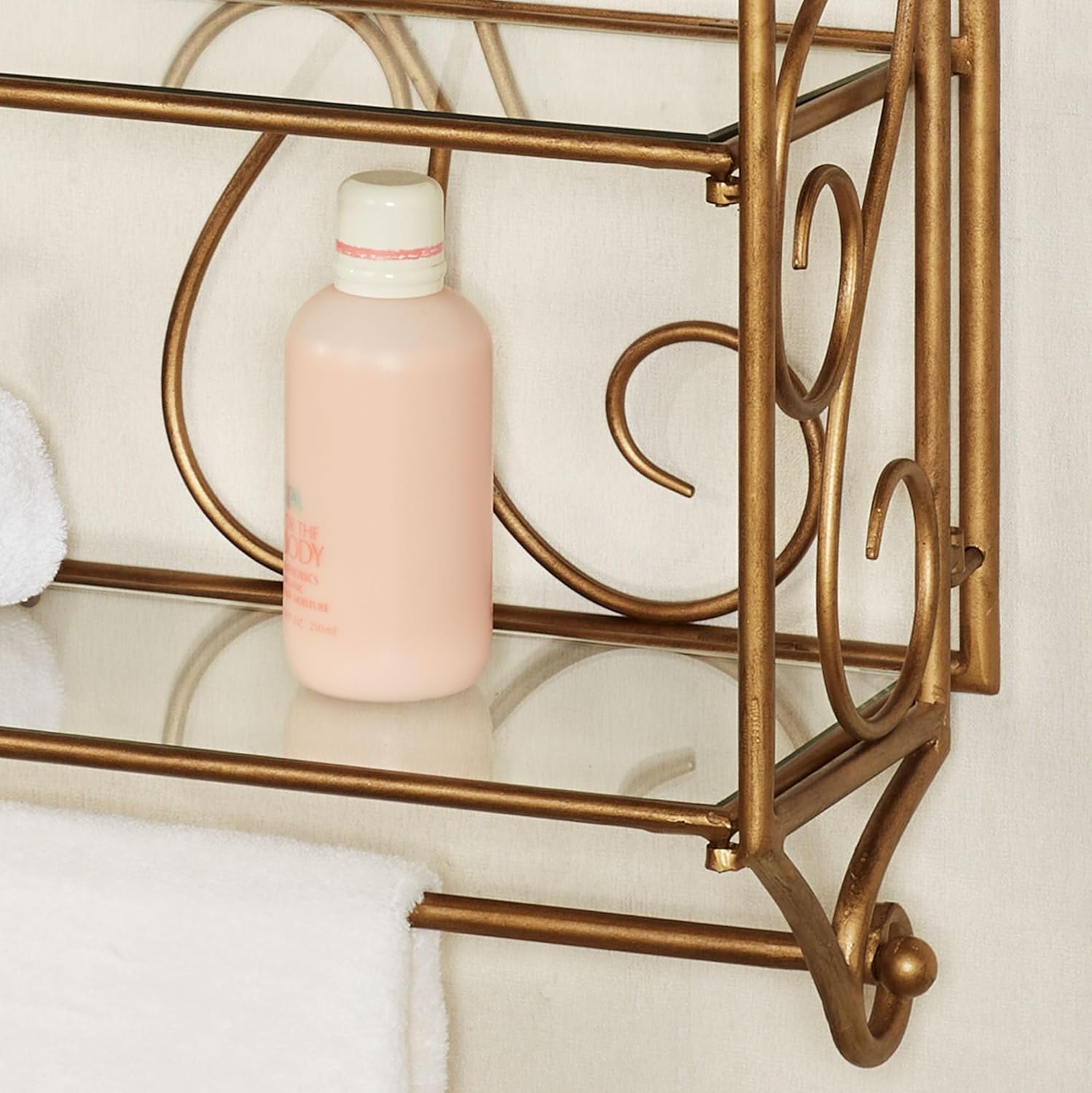 Lanora 3-Tier Storage Wall Shelf | Durable Metallic Aged Gold Powder Coat Finish | Three Wide Glass Shelves | Scrollwork Metal Wall-Mounted Organizer Display with Lower Towel Bar for Hanging Items