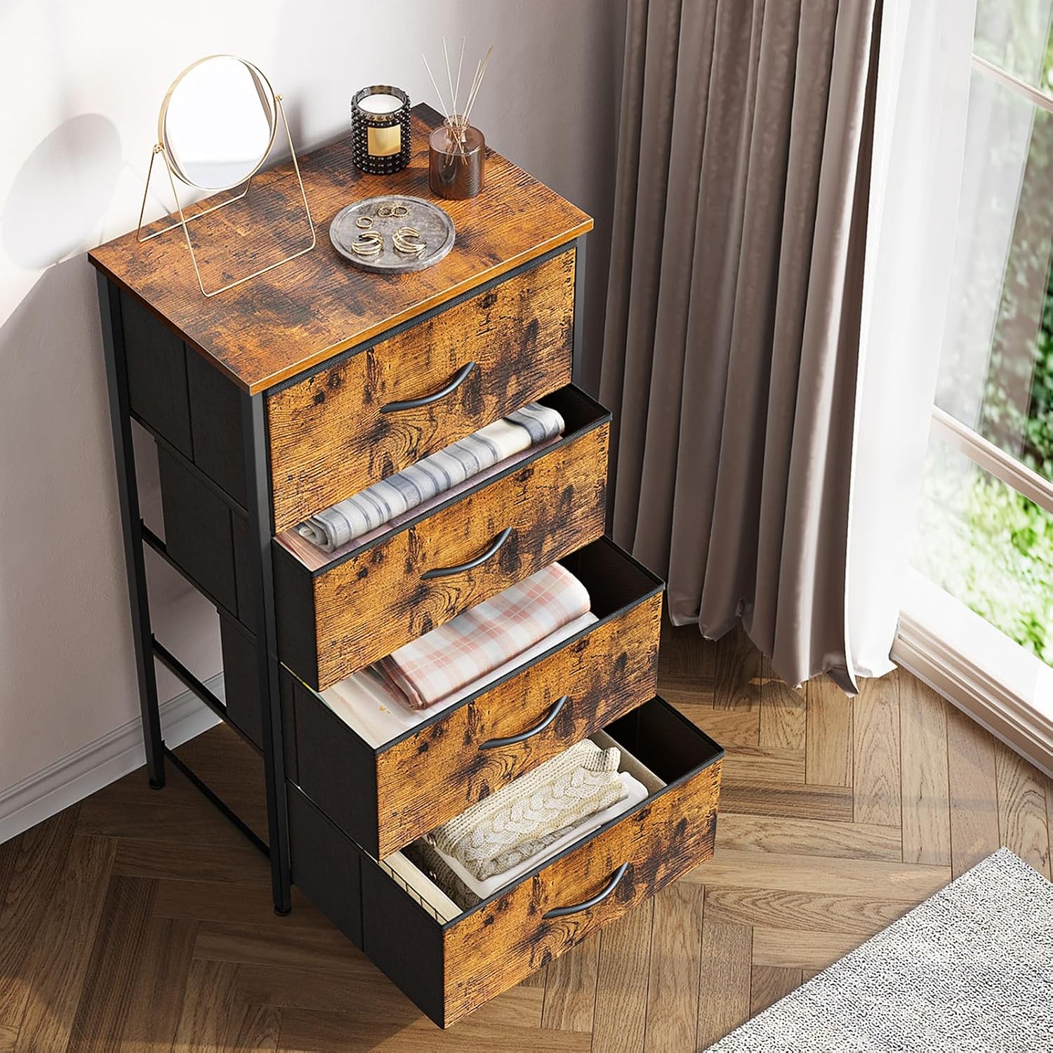 Top-down view of the ODK 4-Drawer Fabric Dresser with all drawers partially open, revealing folded clothes and other items inside, demonstrating storage capacity.