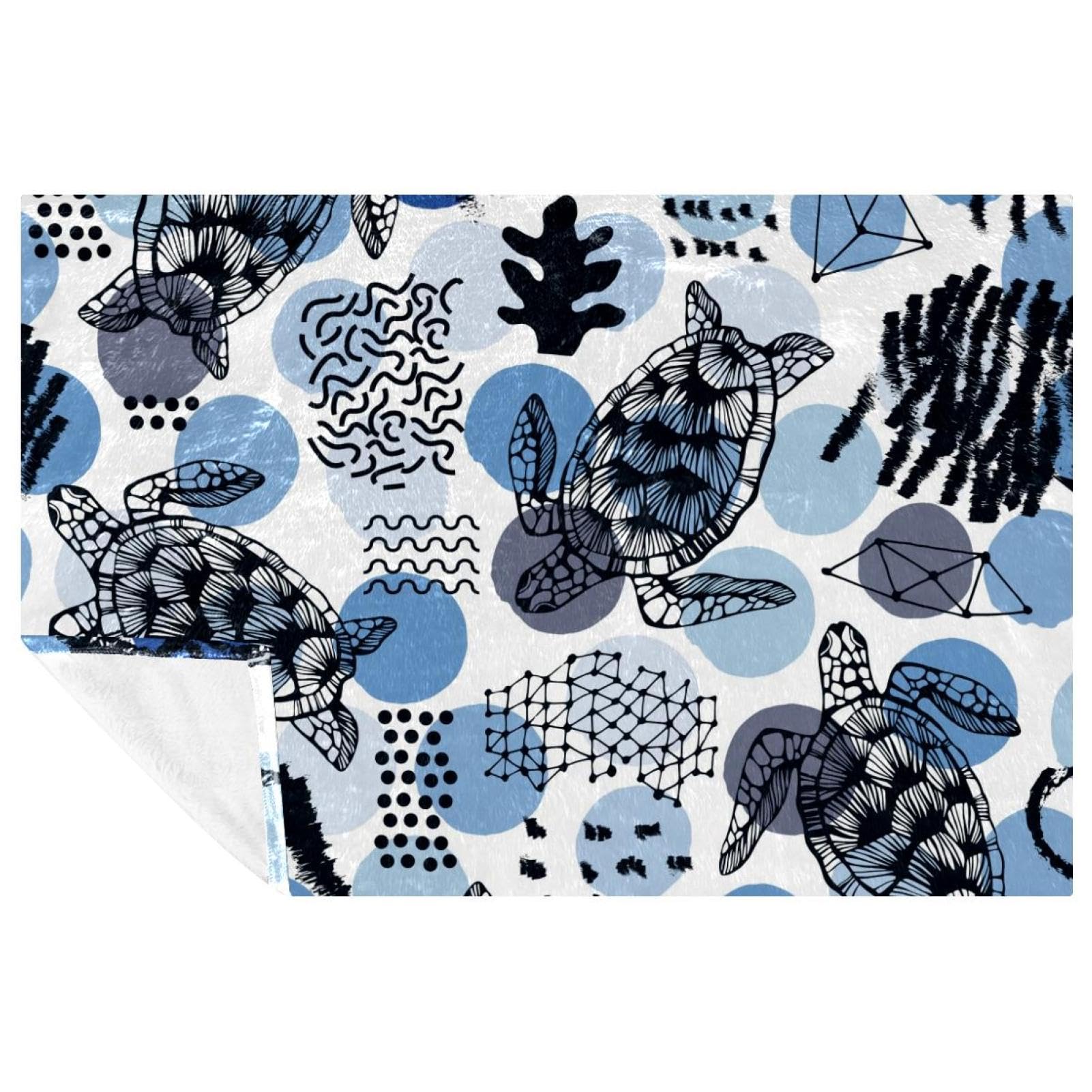 Couverture tortue de mer 150x100 cm au design corail et cercles bleus