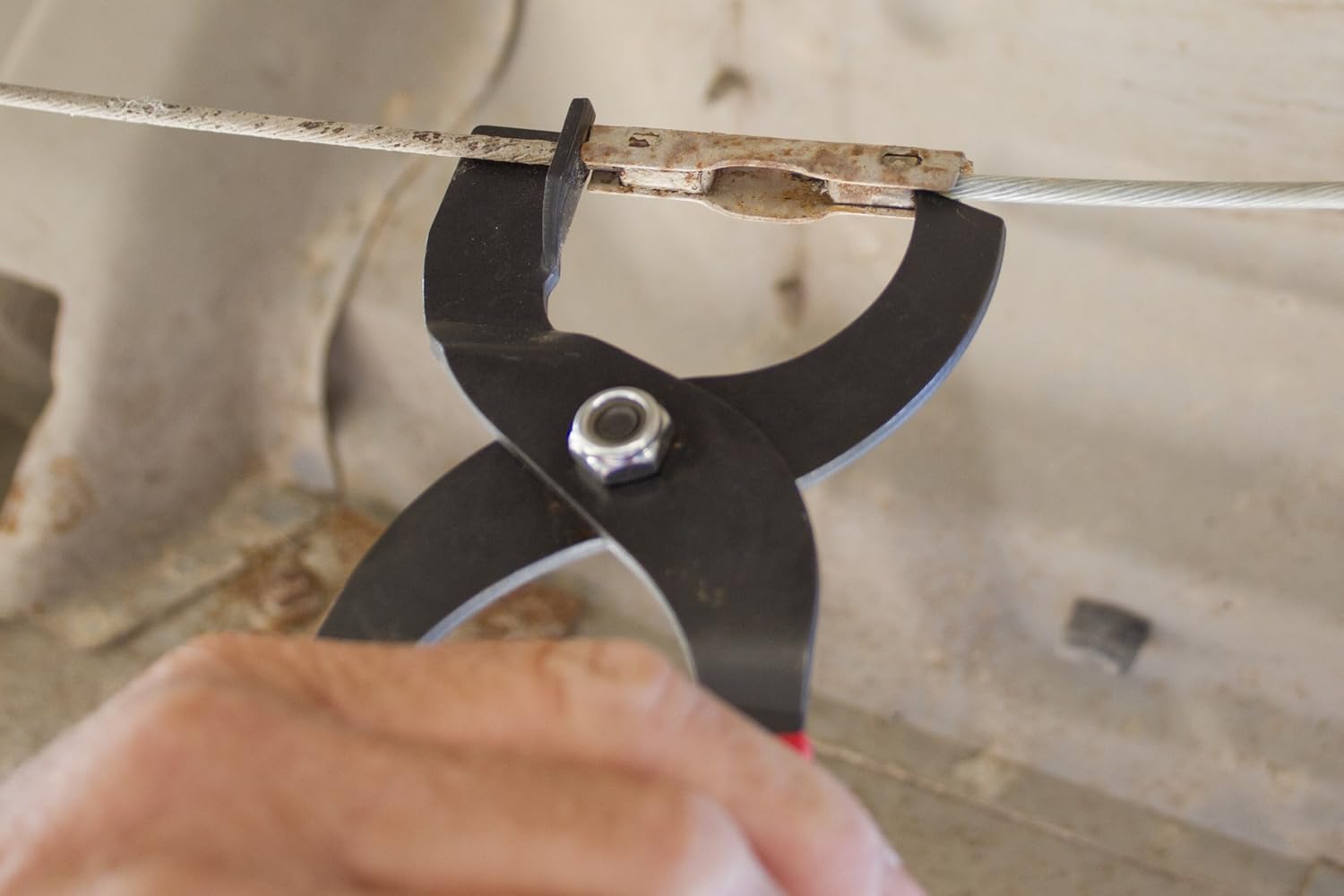 Lisle 44220 Tool in use on emergency brake cable