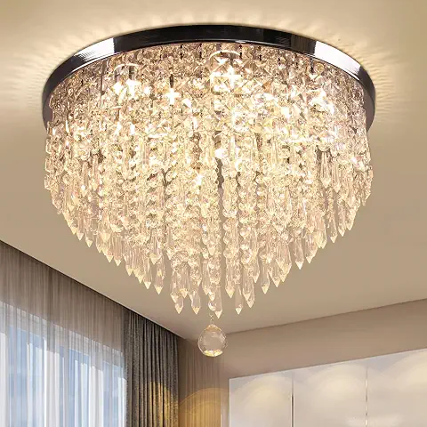 The centerpiece of the room is the stunning crystal chandelier. Its cascading crystal design reflects warm light throughout the space, instantly creating a luxurious hotel-like ambiance.