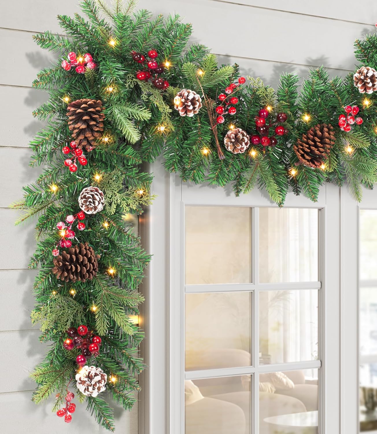 Pre-lit Christmas Garland 9FT with 100 Warm Lights, Battery Operated Xmas Garland with Pine Cedar Cones & Red Berries, Christmas Decoration for Mantle Fireplace Stair Railing Porch Evergreen Glow