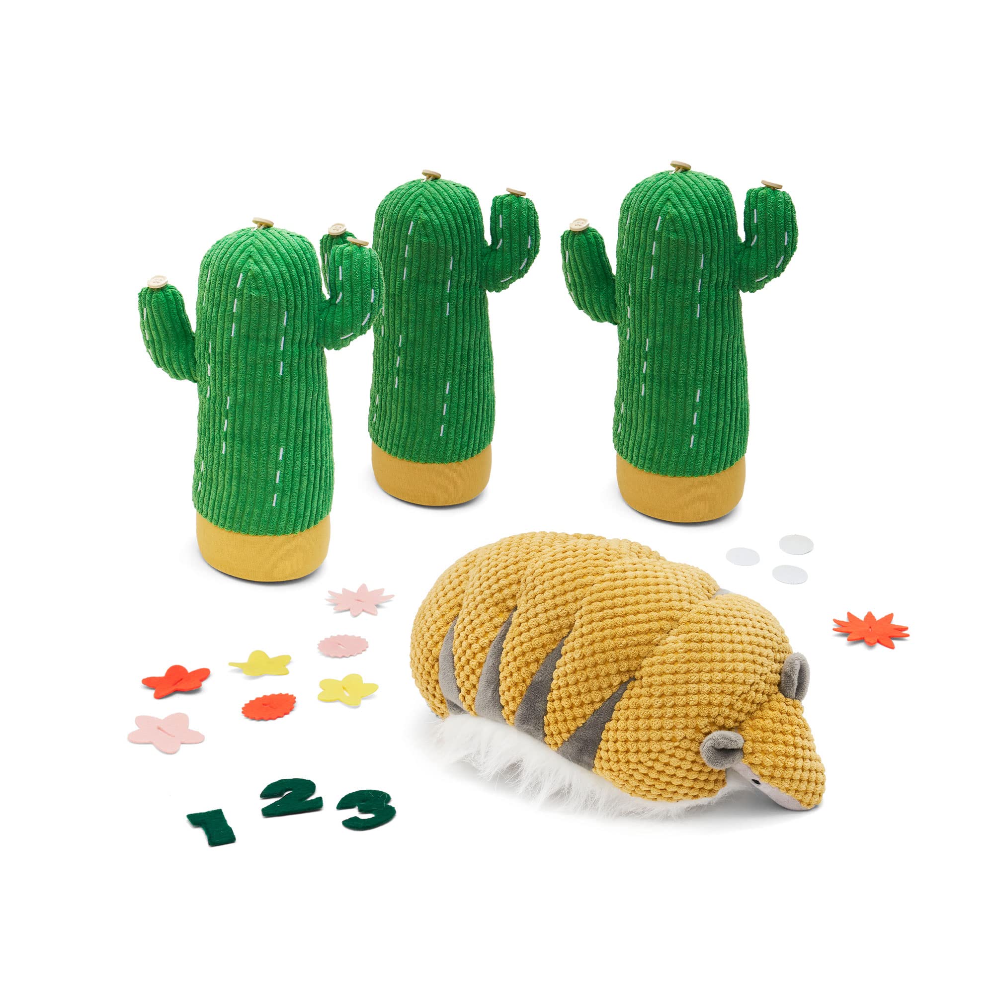 Armadillo plush rolled into a ball, ready for bowling.