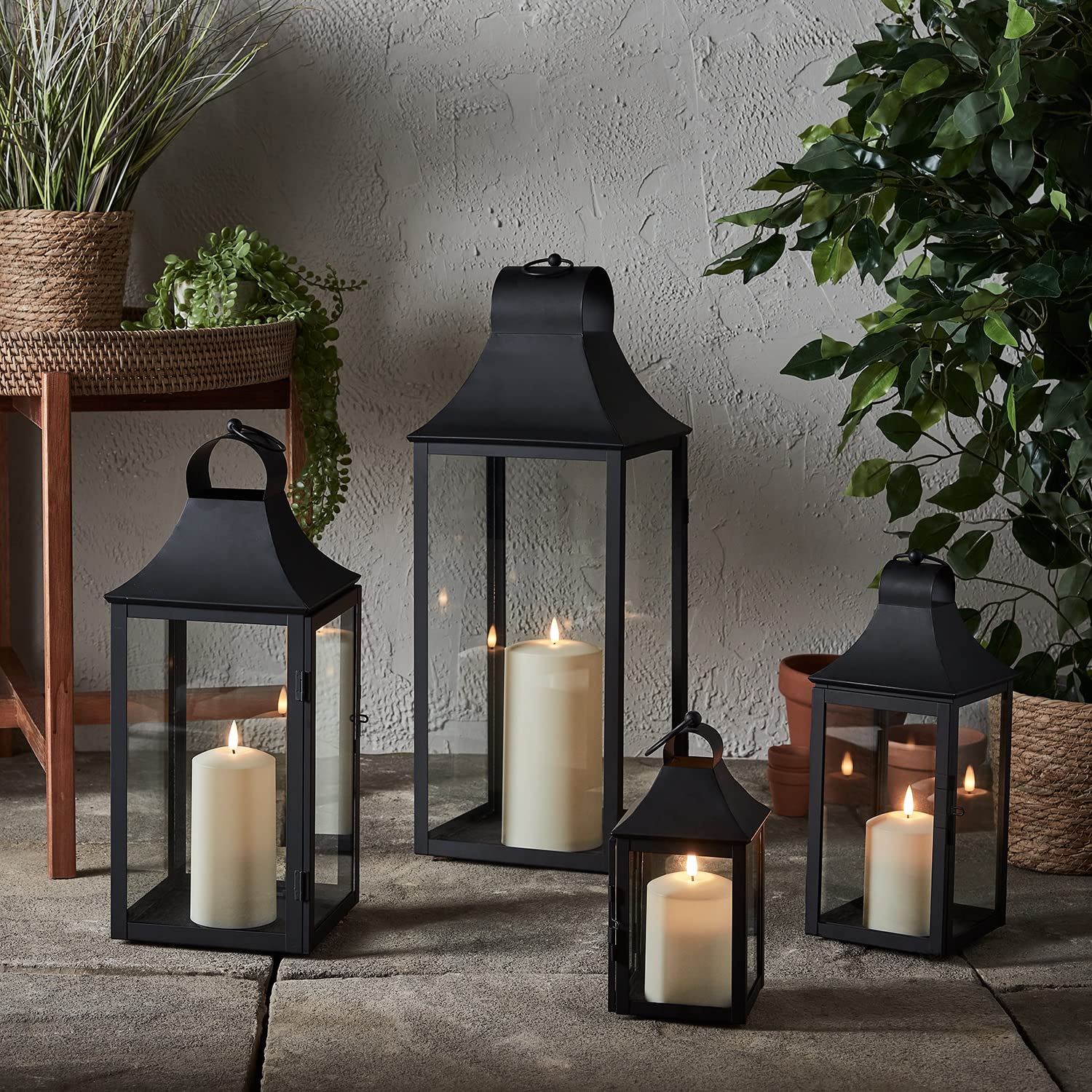 Lights4fun Set of 4 Outdoor Garden Classic Black Metal Decorative Lanterns with TruGlow® LED Candles Battery Operated Timer