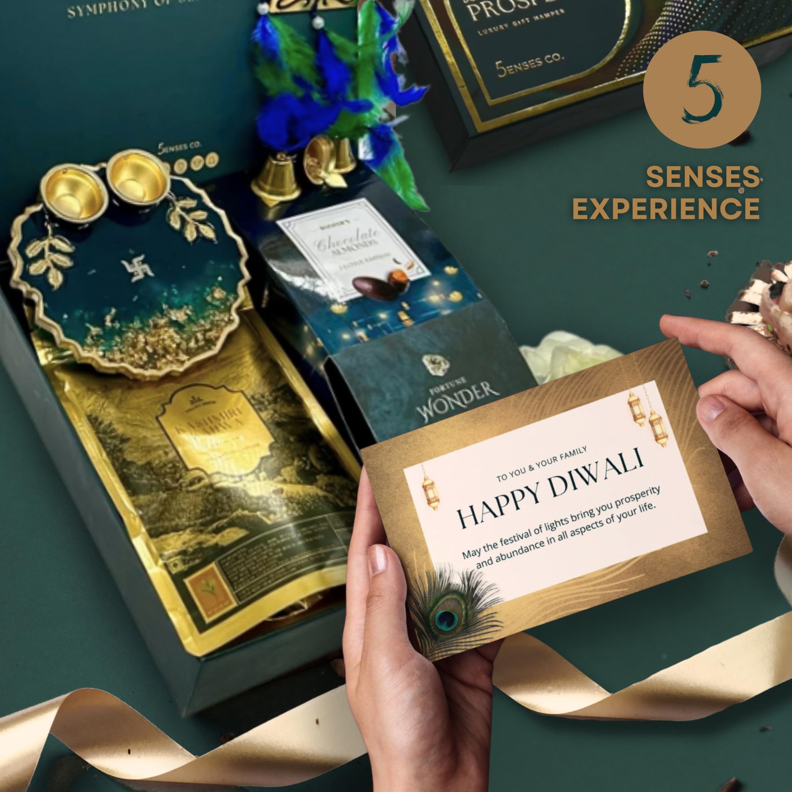 5 Senses Co. Prosperity Box Luxury Gift Hamper- Contains Chocolate Almonds, Kashmiri Kahwa Green Tea, Pyrite Bracelet for Wealth | Resin Pooja Diya Thali & Ganesh Hanging | Premium New Year | Diwali Gift Box for Family & Friends | Corporate Gifts | House Warming Gift | Pooja Gift | Return Gift 1