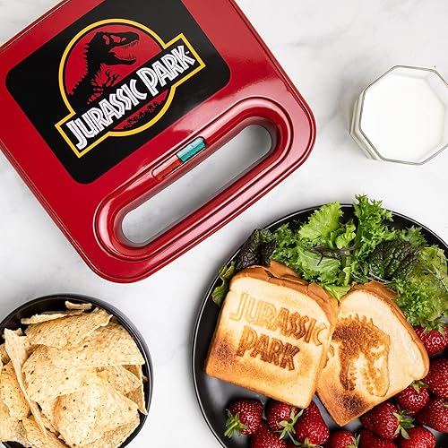 Uncanny Brands Jurassic Park Grilled Cheese Maker- Panini Press and Compact Indoor Grill- Opens 180 Degrees for Burgers, Steaks, Bacon (PP-JUR-JP)
