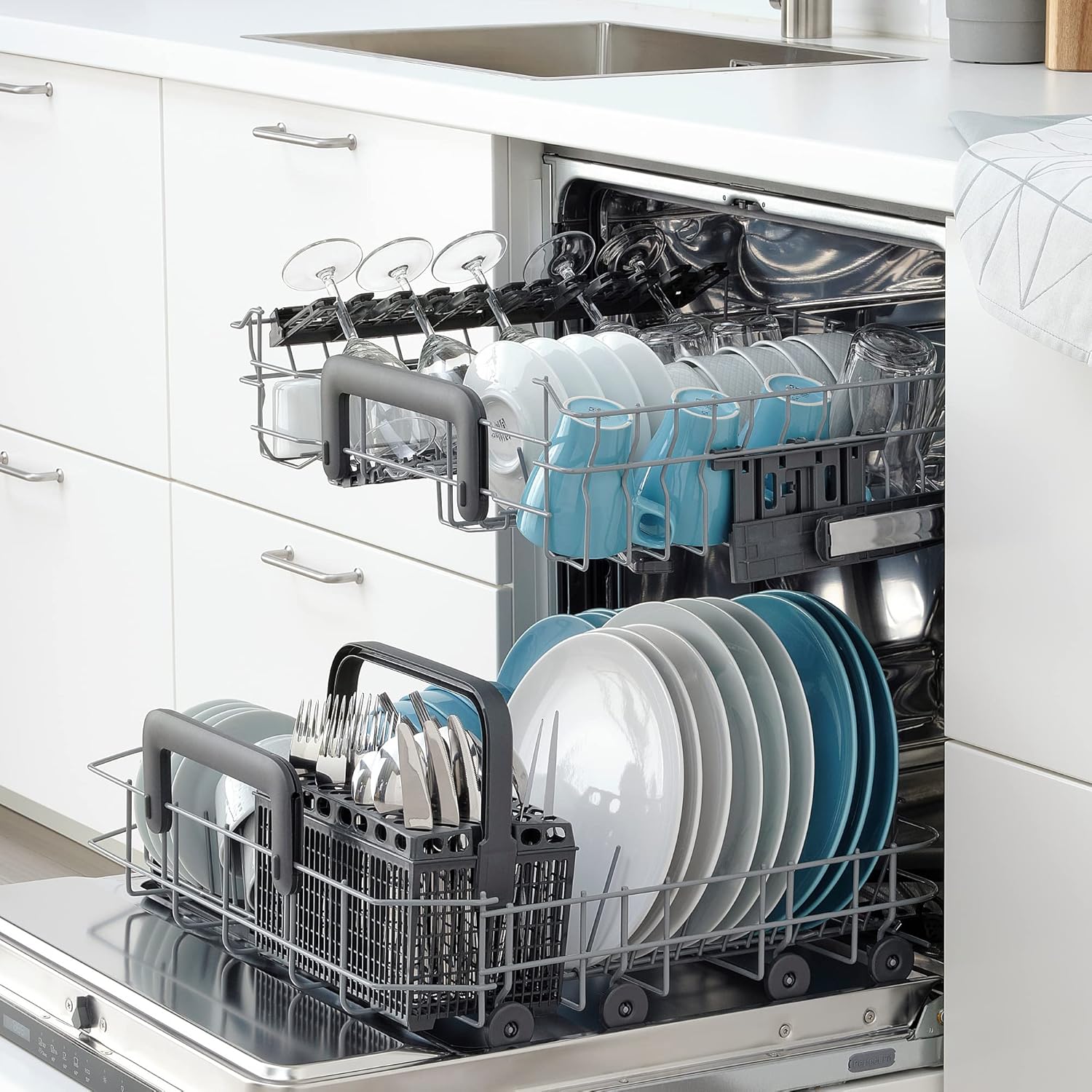 Top view installation diagram for RENODLAD dishwasher showing water and electrical connections
