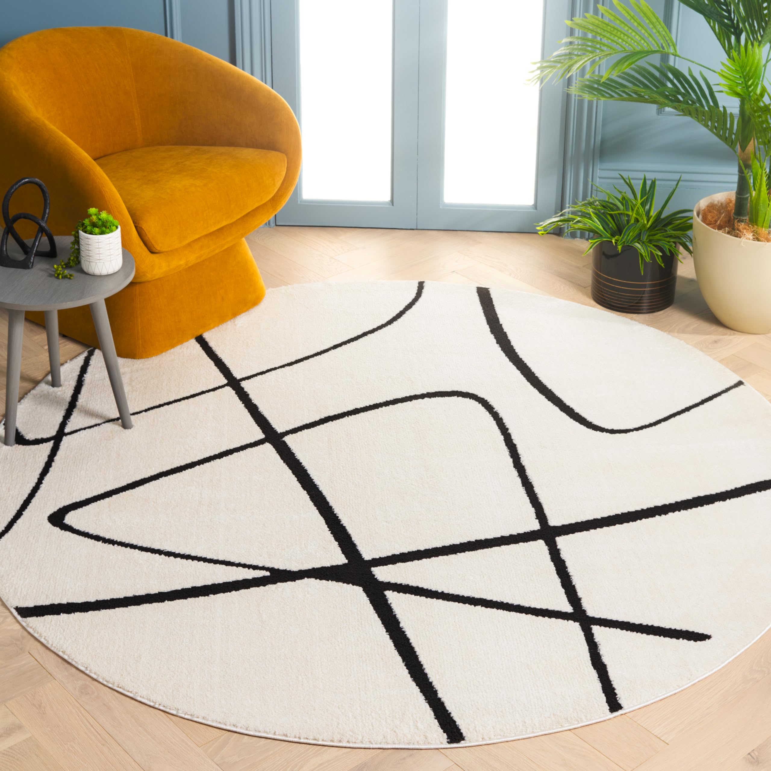 SAFAVIEH Melody Collection Area Rug - 4' Round, Ivory/Black, Geometric Design, Ideal for High Traffic Areas in Living Room, Bedroom, Dining (MEL120A)