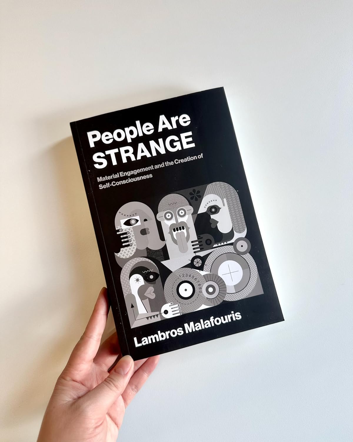 People Are STRANGE: Material Engagement and the Creation of Self-Consciousness