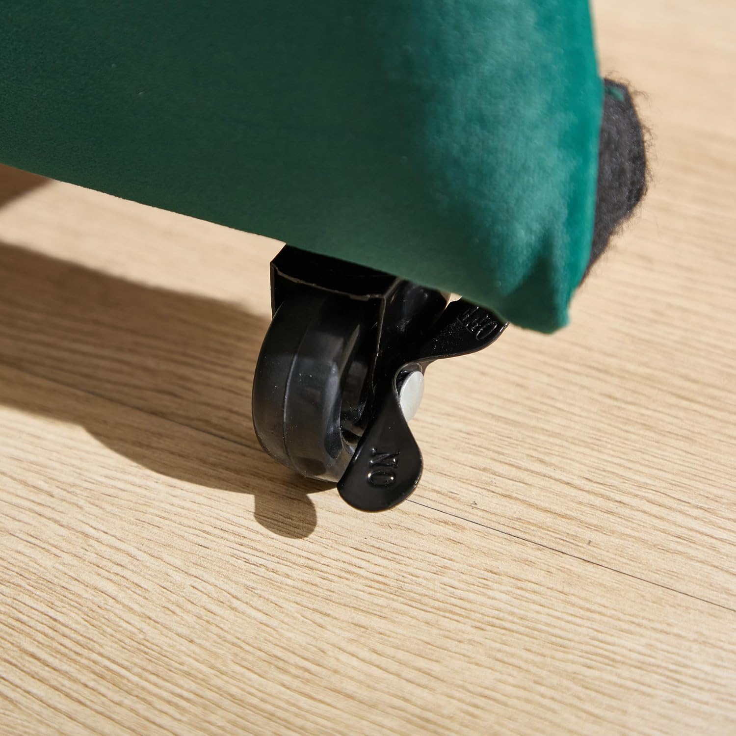 Close-up of a trundle wheel with a locking mechanism.