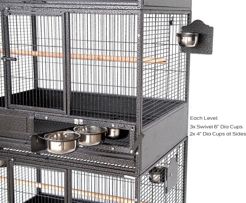 Close-up of bird cage feeder cups