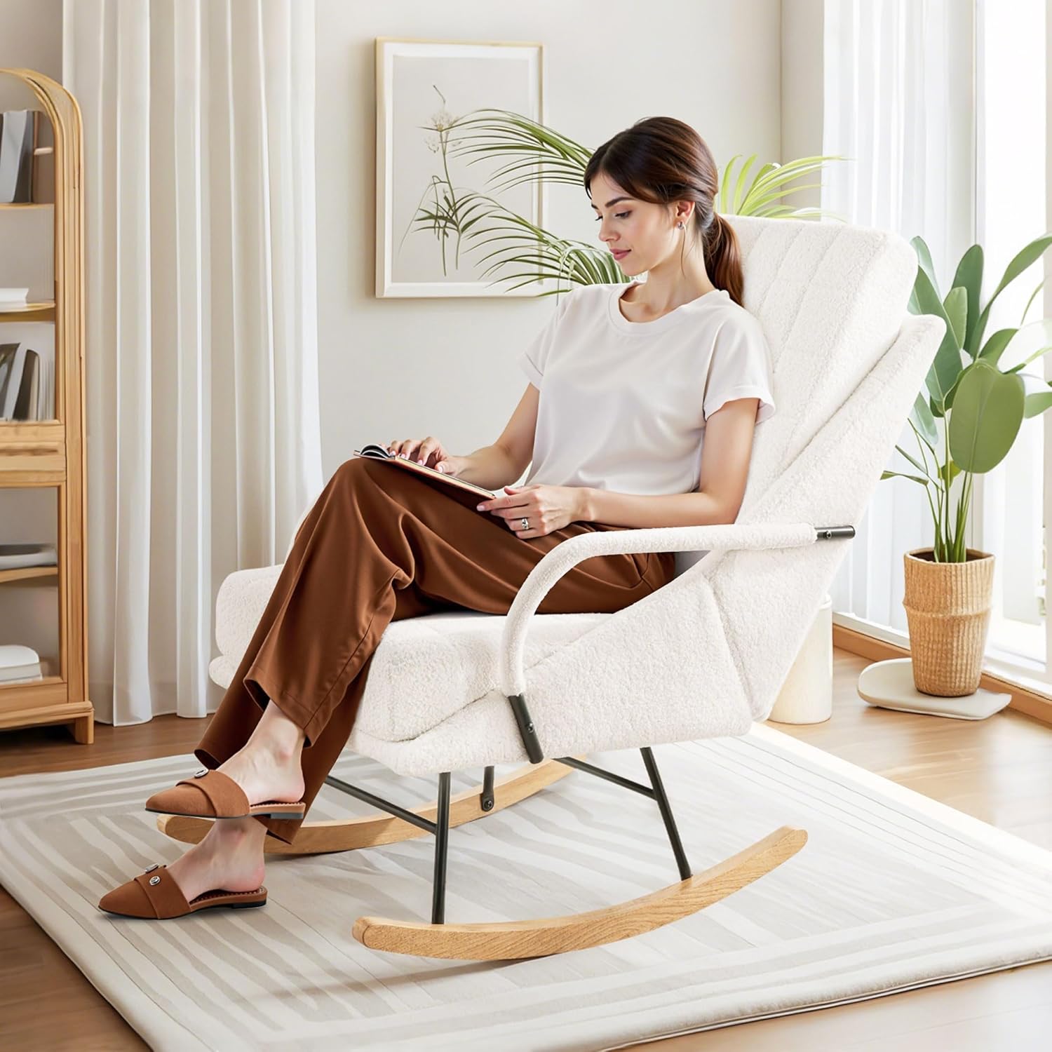 A person sitting comfortably in the assembled VECELO rocking chair, demonstrating its use.