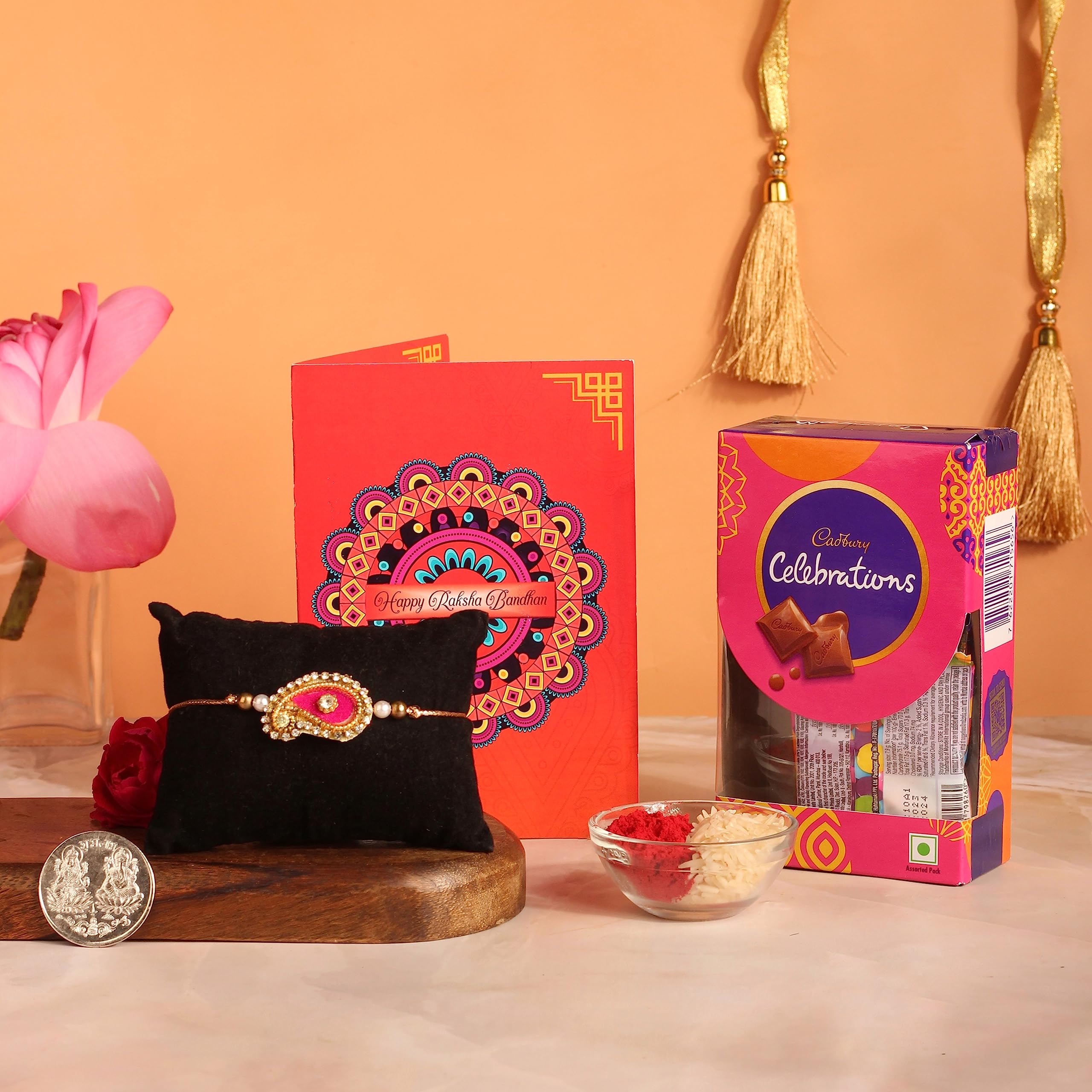 Frostick Designer Rakhi With Chocolate Gift For Bhaiya/Bhai/Brother With Greeting Card, Tilak Chawal And Silver Coin (Small Cadbury Celebration, Pack Of 1) (Random Design Rakhi, 130 Gm) (B0C626Q9QJ) Amazon Price History, Amazon Price Tracker