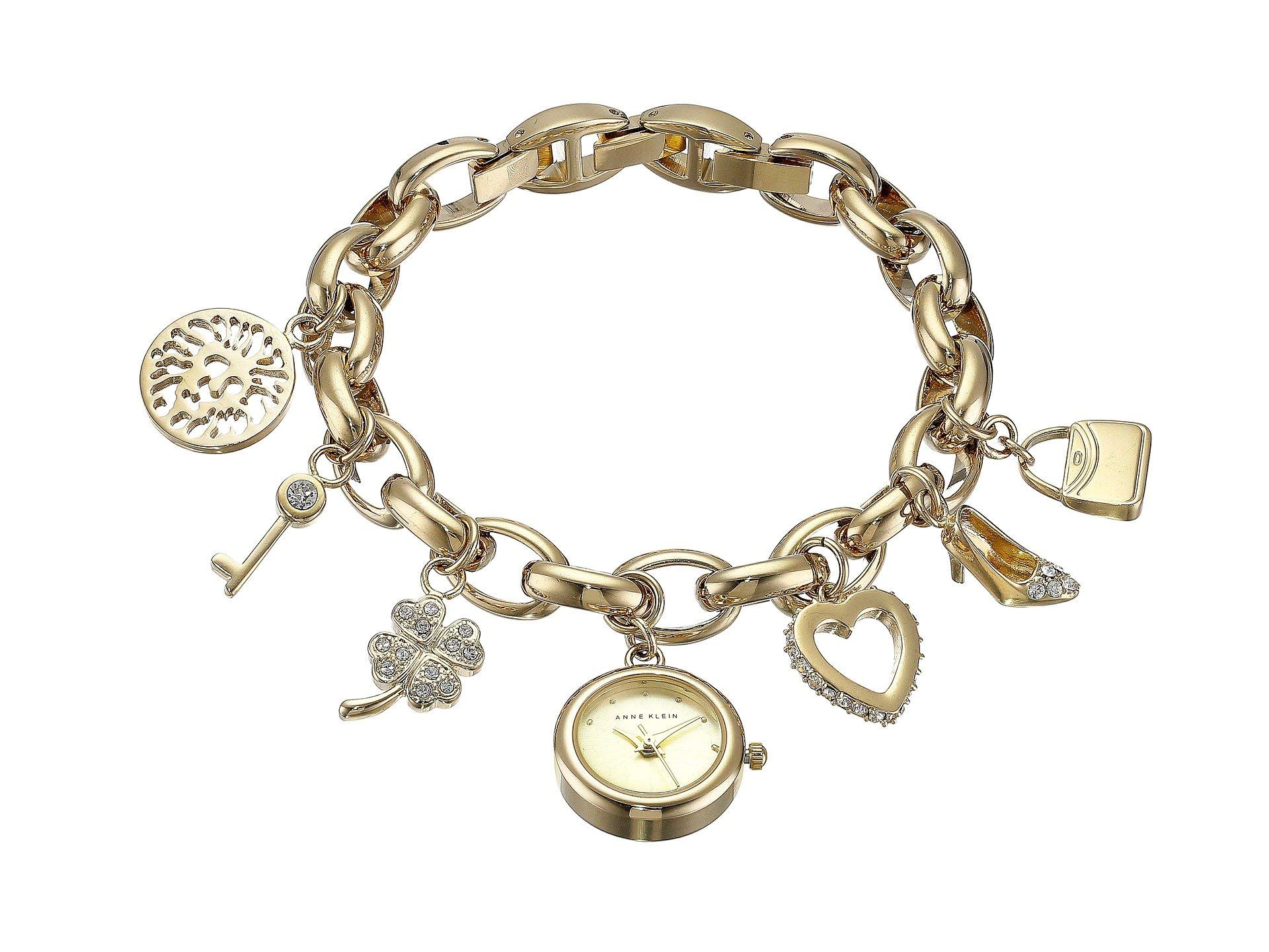 Anne Klein Women's Premium Crystal Accented Gold-Tone Charm Bracelet Watch, 10/7604CHRM