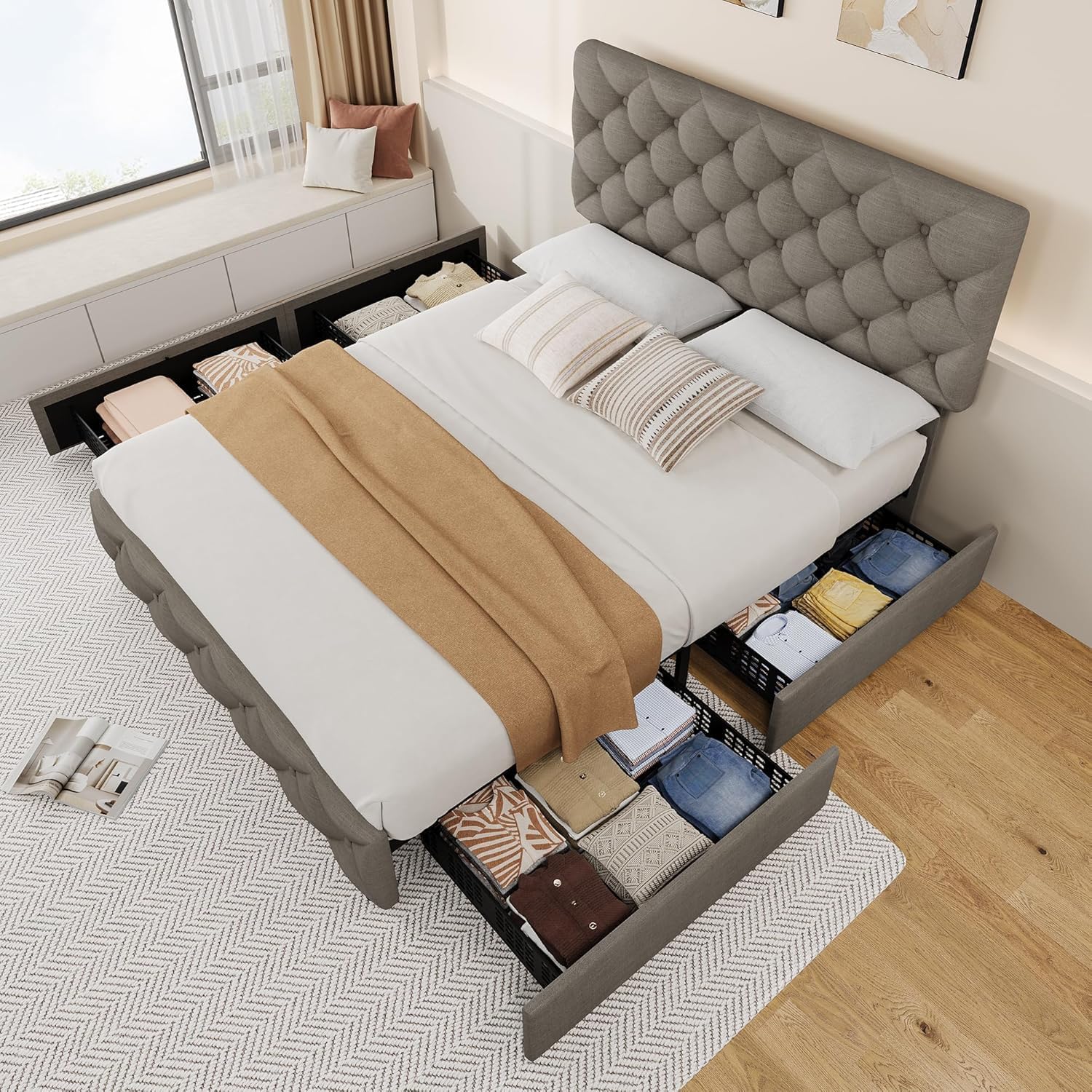 Bed frame with all four storage drawers pulled out, showing clothes stored inside