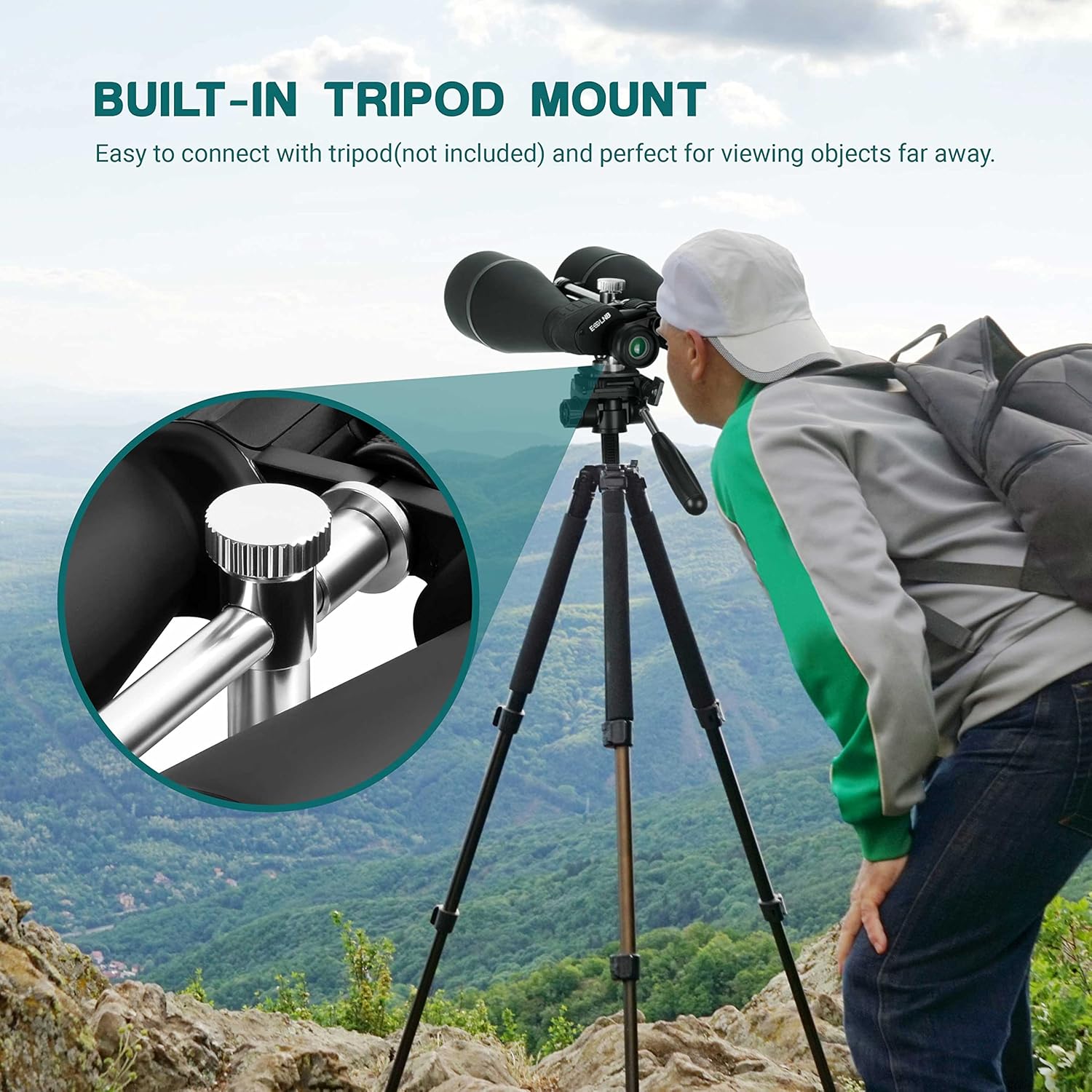 Person using binoculars mounted on a tripod