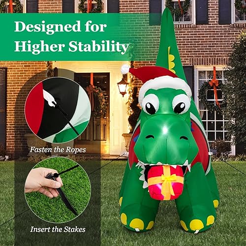 Miniatura 7 de Tangkula Mordedura inflable de dinosaurio de Navidad iluminada de 6 pies, caja de regalo, decoración inflable de Navidad con luces LED y caja de