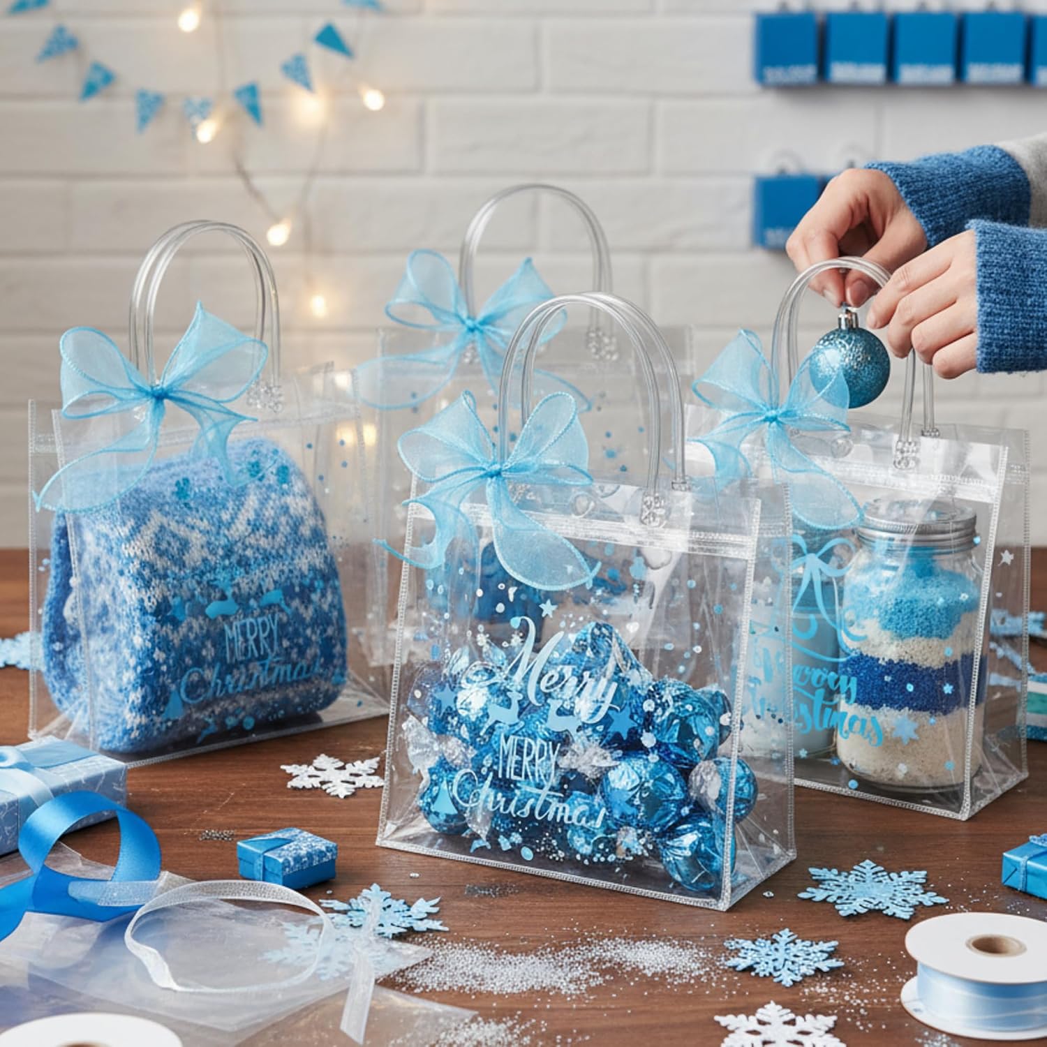 Henoyso 24 Pcs Blue Christmas Clear Gift Bags Plastic Goodie Candy Treat Bag with Handles PVC Gift Wrap Totes with Ribbon for Xmas Party Favors (7.8 x 7.8 x 3.1)