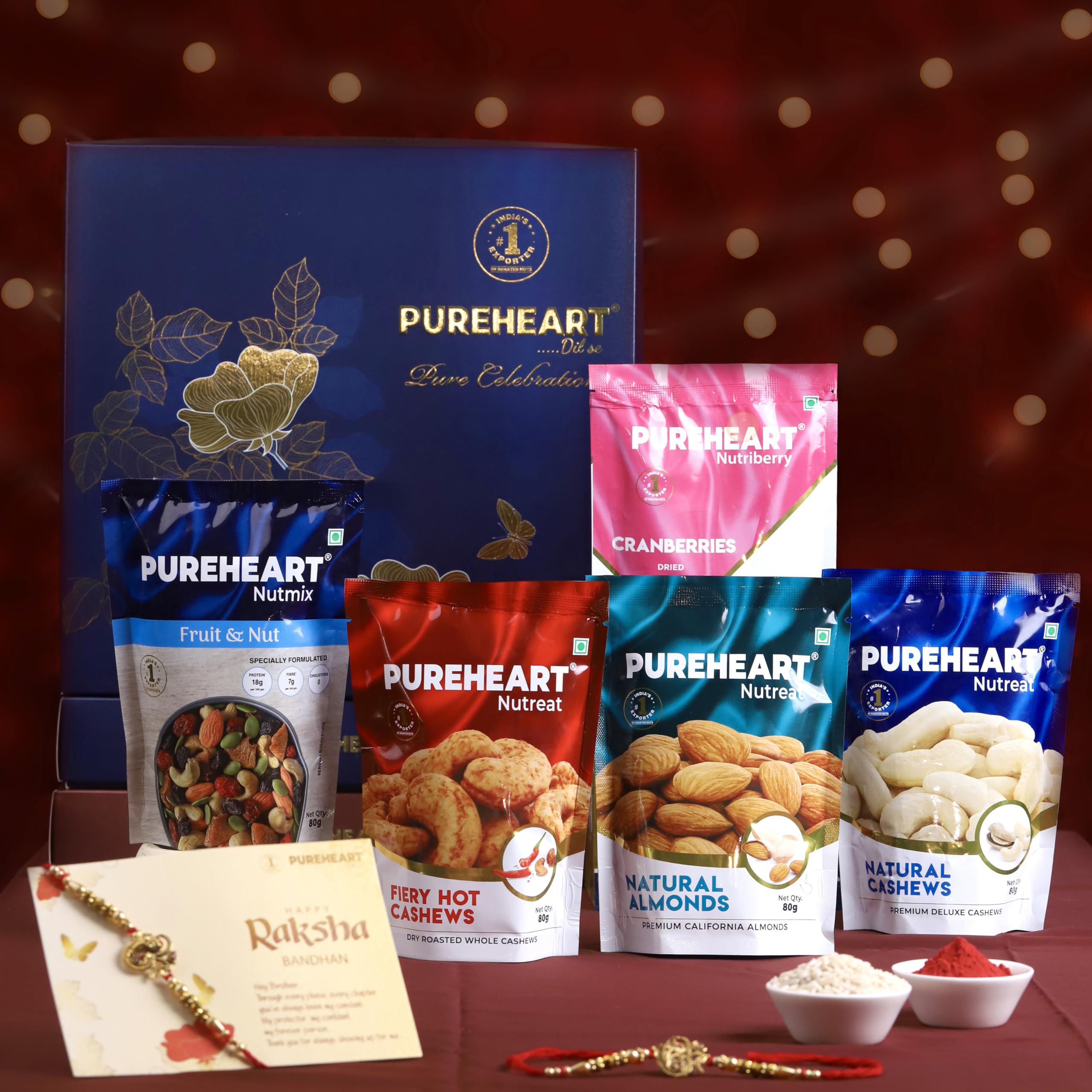 PUREHEART Rakhi Gift Hamper - Natural and Fieryhot Cashews, Almonds, Fruit & Nut Nutmix, Cranberries (80 g, each), Dark Chocolate with Rakhi for Brother, Card, Rice, Kumkum